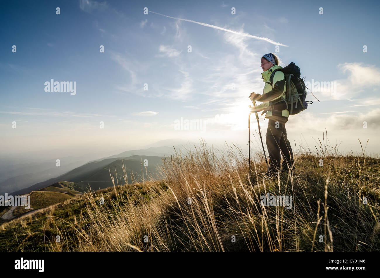 Female hiker, woman in her early 40, standing on Col Visentin mountain ...