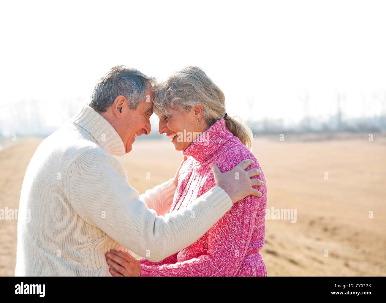 Senior couple looking with love into each others eyes Stock Photo