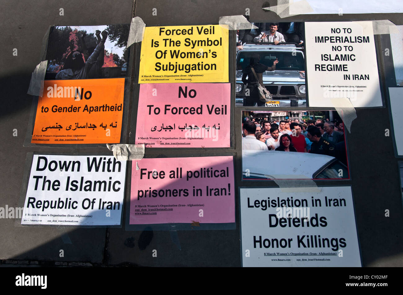 Posters on pavement protesting for political prisoners in Iran Stock Photo