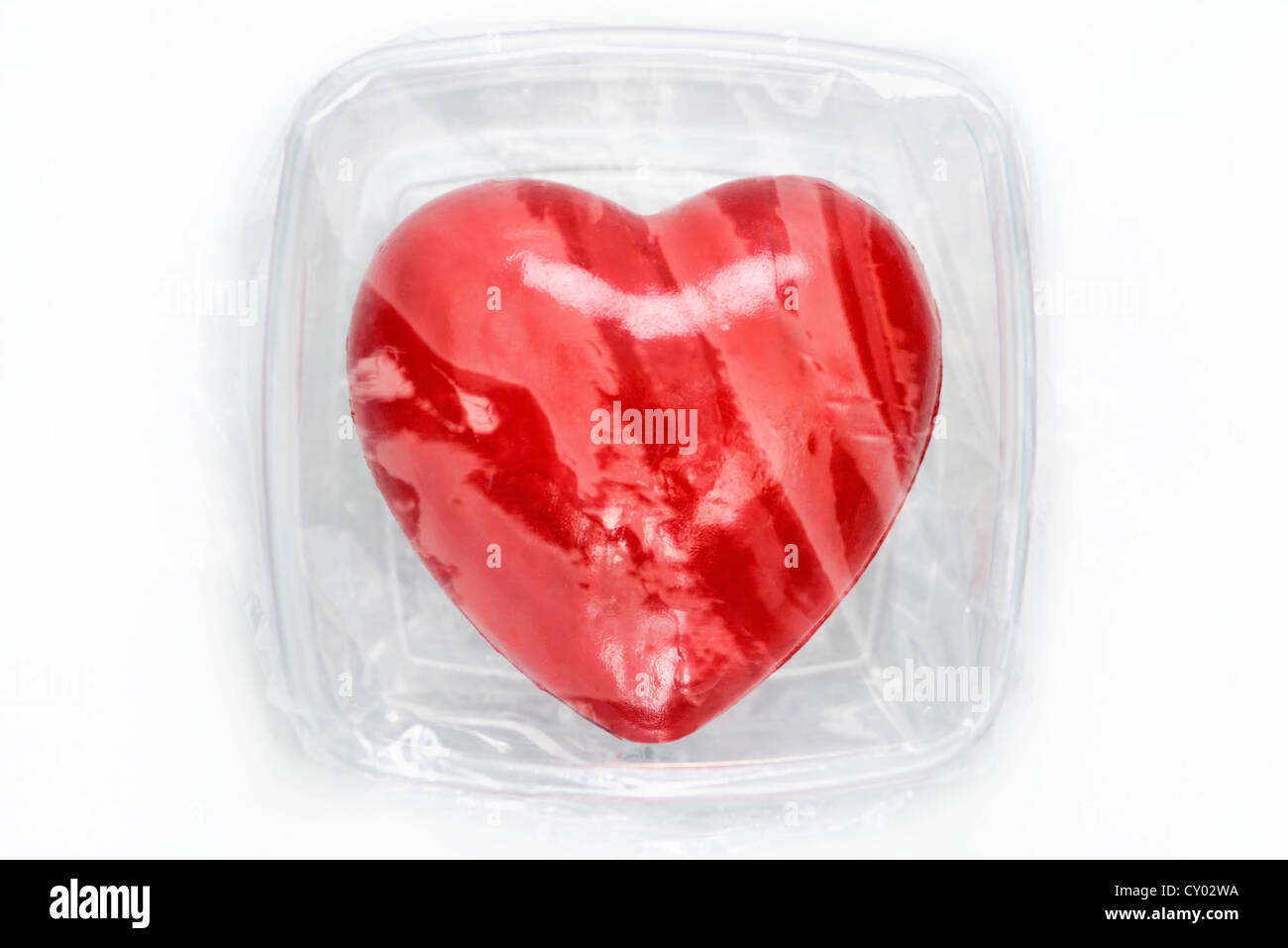 Heart in food storage container, symbolic image organ donation Stock Photo