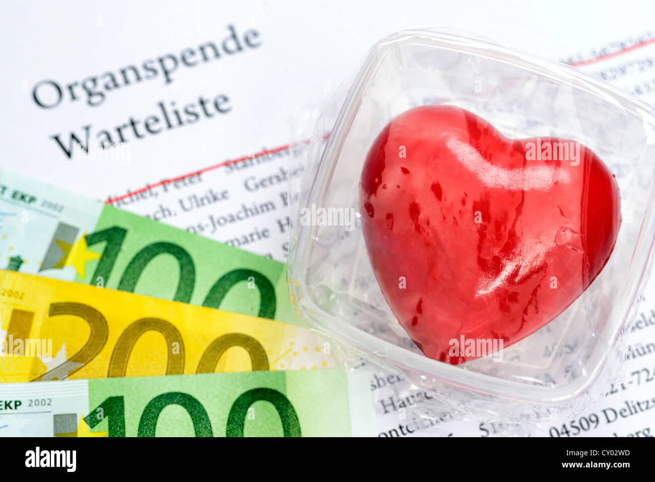 Heart in food storage container on organ donation waiting list, symbolic image for organ donation Stock Photo