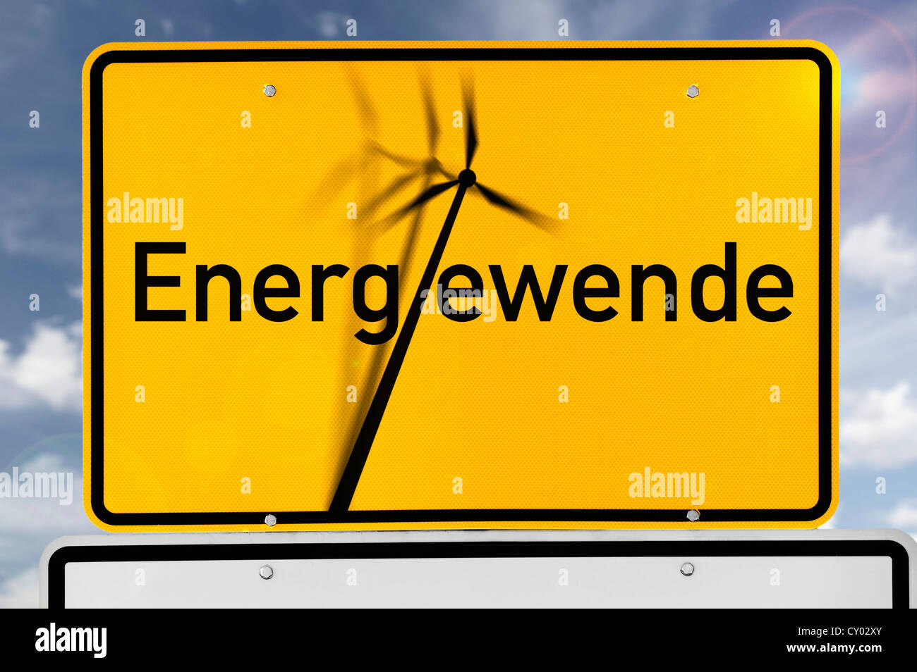 Lettering 'Energiewende', German for 'energy turnaround' with a falling wind turbine on a German village sign, symbolic image Stock Photo