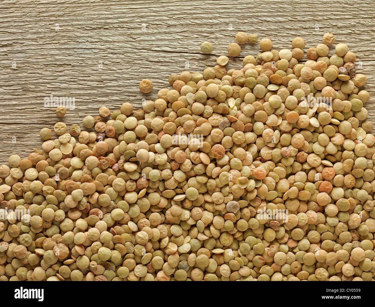 dried lentils on rustic wooden table Stock Photo