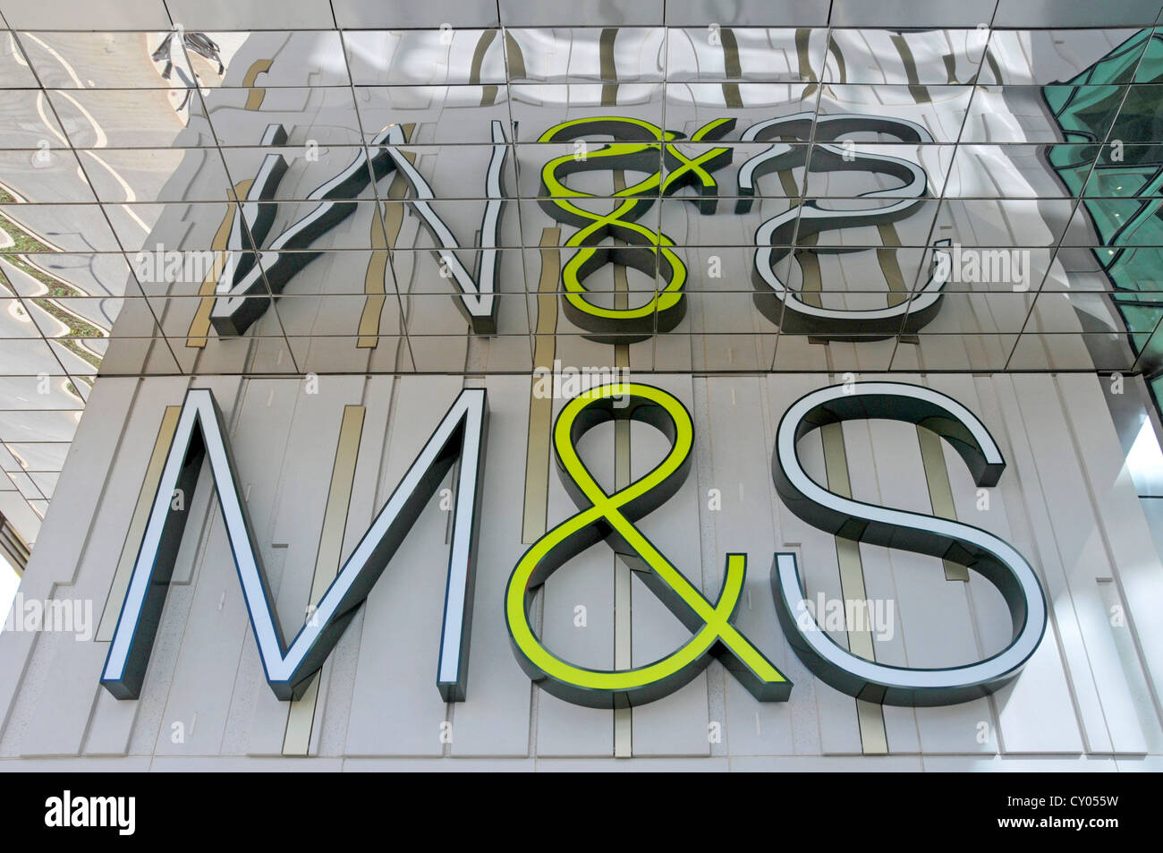 M&S store sign logo reflection in mirror tiles above Marks and Spencer shop at Westfield