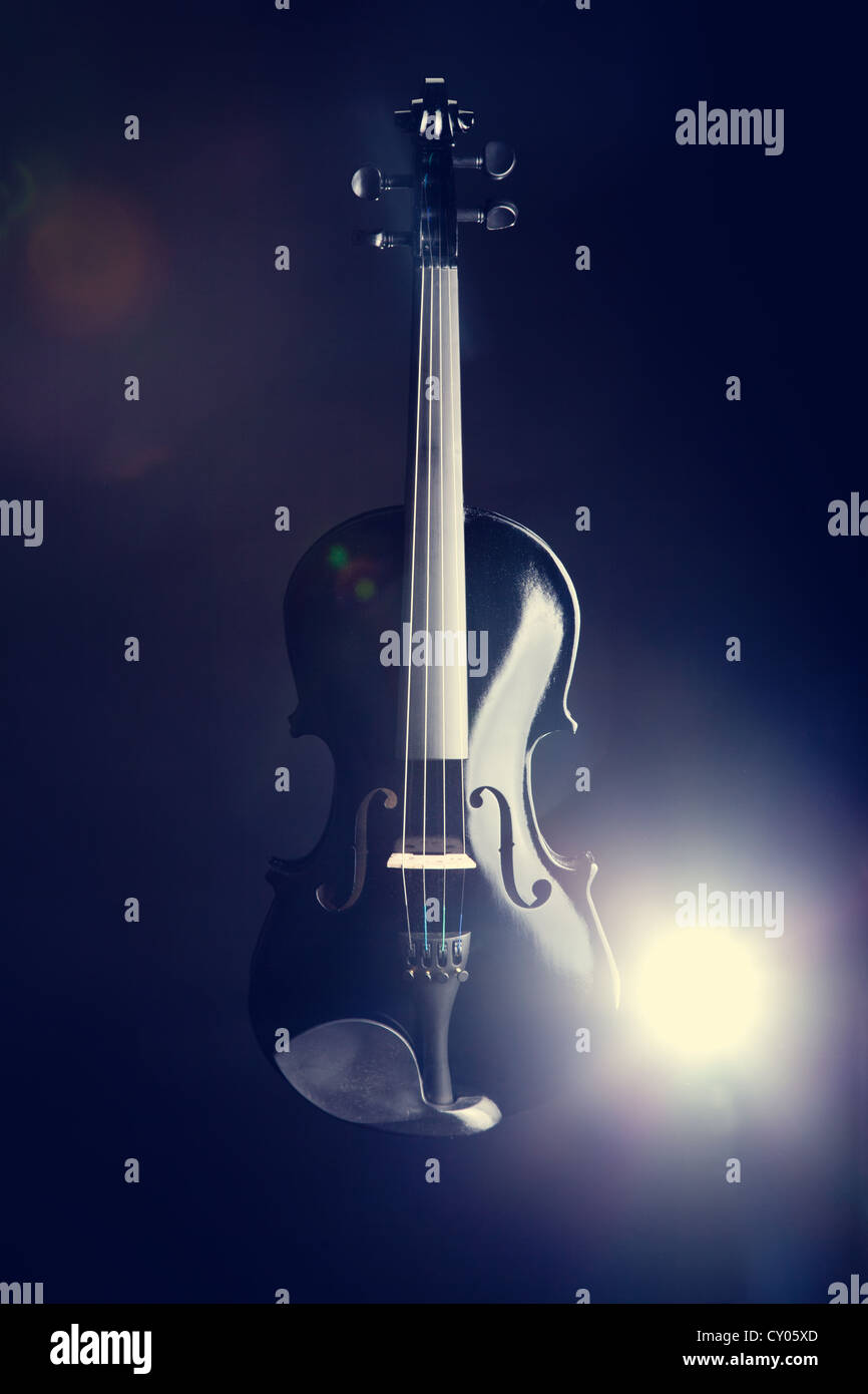 Premium Photo  Violin over a dark background