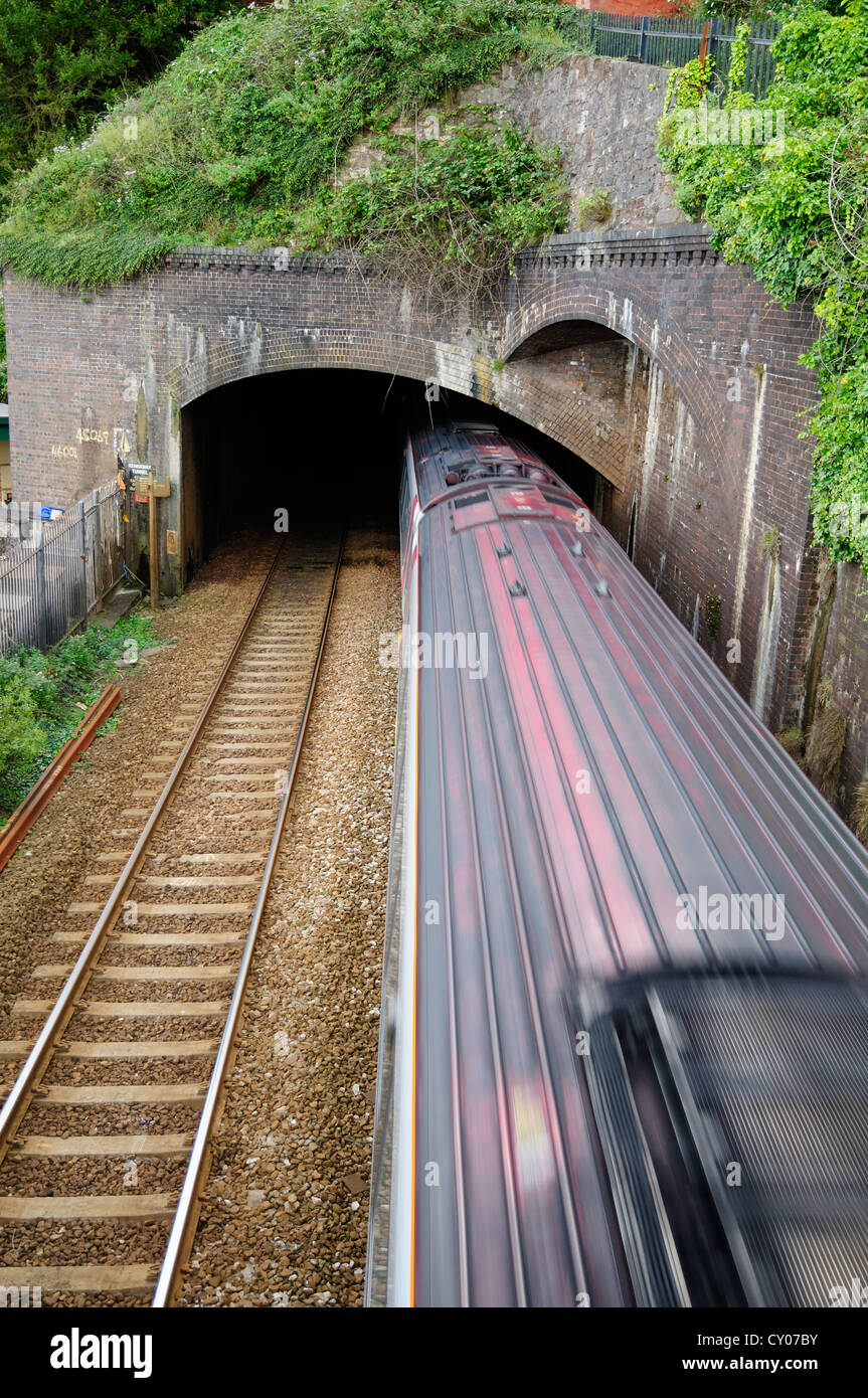 Virgin Trains Voyager train leaving Kennaway Tunnel in Dawlish Stock Photo