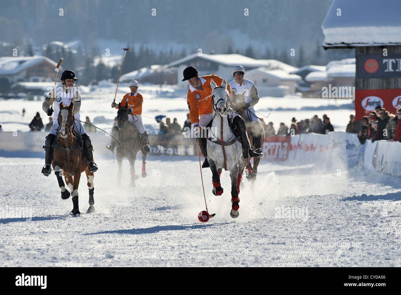 Pedro Fernandez Llorente of team 'Kitzbuehel' playing the ball, followed by Marie-Jeanette Ferch of team 'Parmigiani', polo Stock Photo