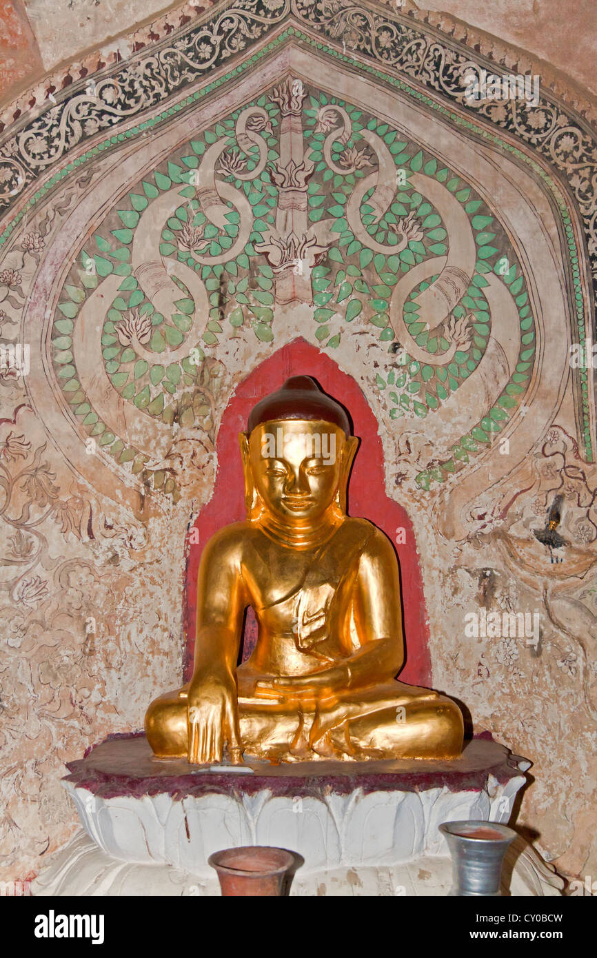 A gilded BUDDHA STATUE at SULAMANI PHATO which was completed by King Narapatisithu in 1211 AD - BAGAN, MYANMAR Stock Photo