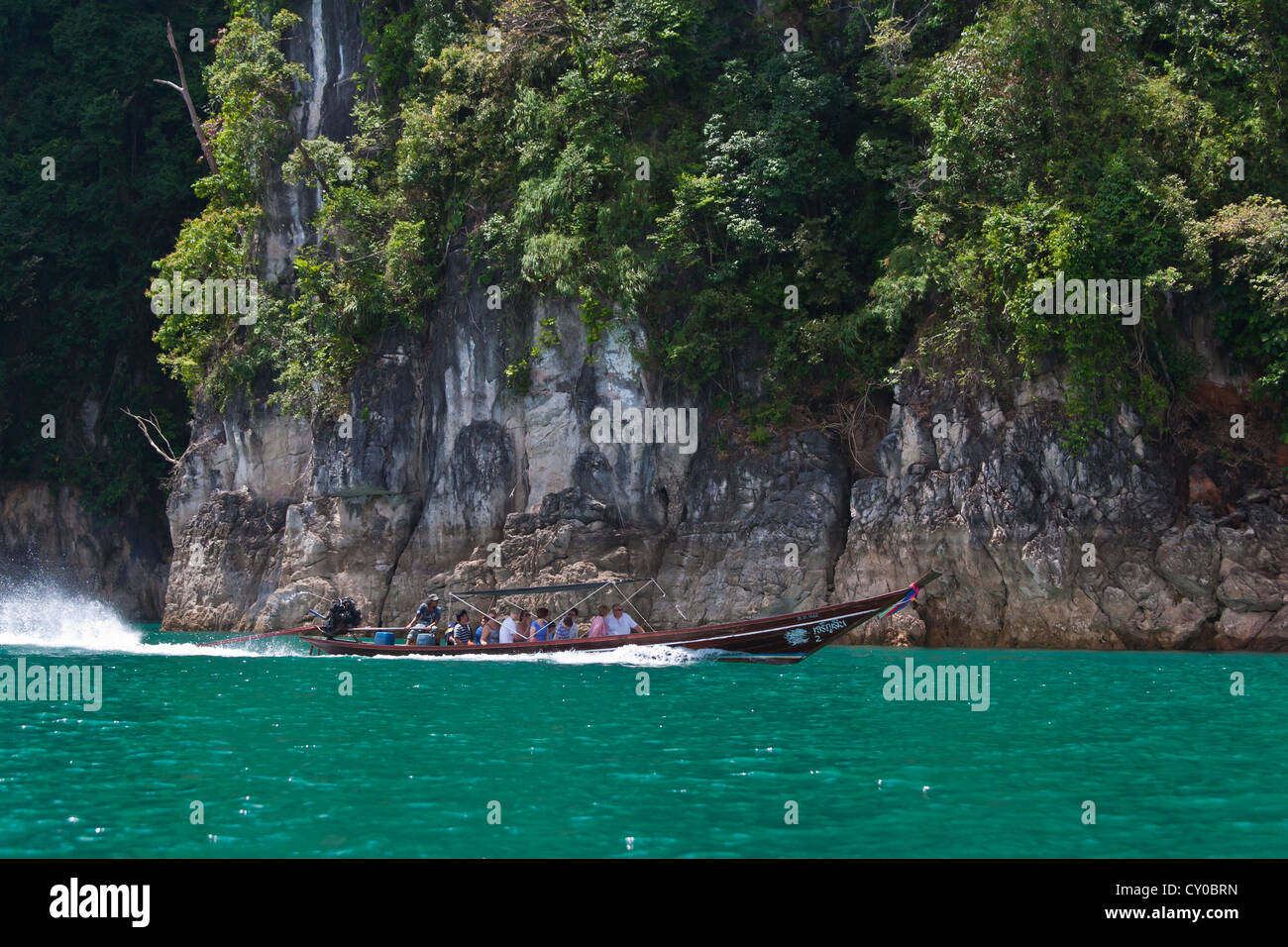 Boating on CHIEW LAN LAKE is the best way to see KHAO SOK NATIONAL PARK - SURATHANI PROVENCE, THAILAND Stock Photo