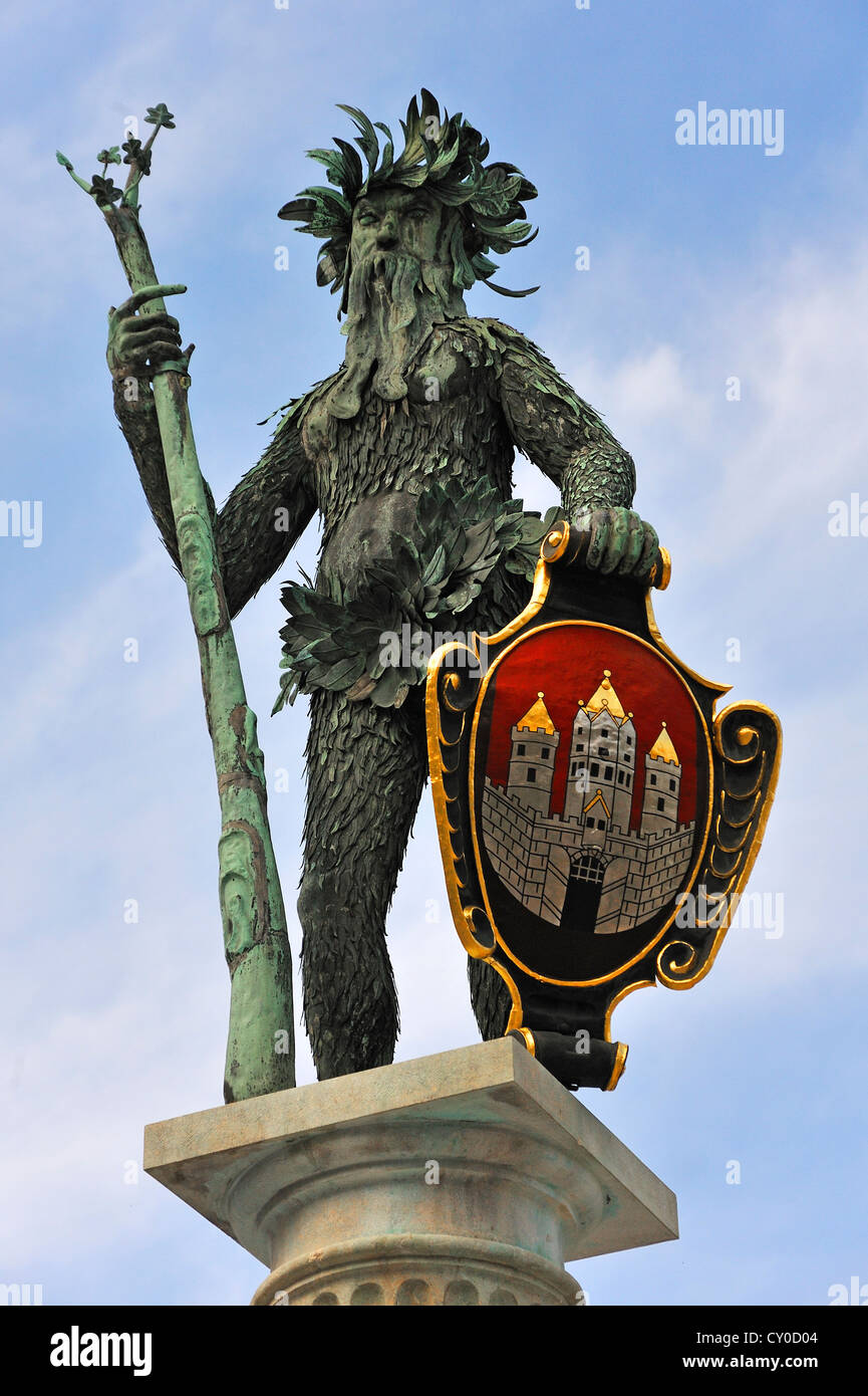 'Wild Man fountain', figure made of sheet copper in 1620, with the coat of arms of Salzburg, Max-Reinhardt-Platz square Stock Photo