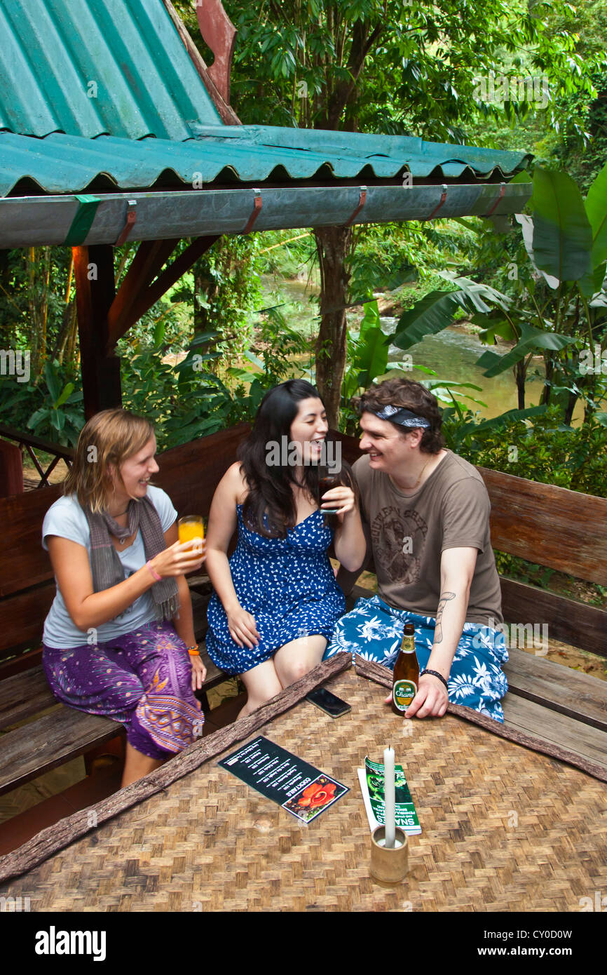 Guests enjoy the upstairs bar and restaurant at OUR JUNGLE HOUSE near KHAO SOK NATIONAL PARK - SURATHANI PROVENCE, THAILAND Stock Photo