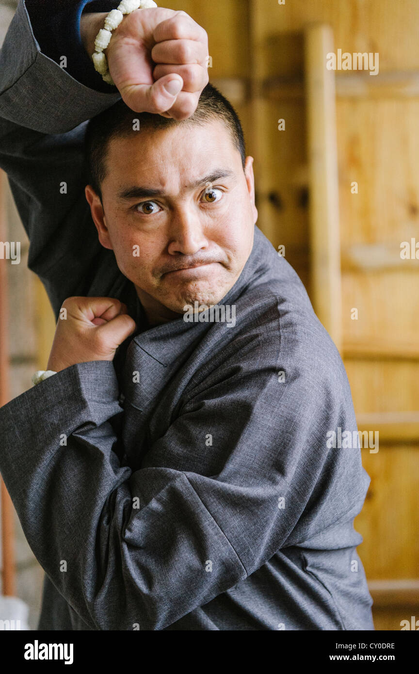 Shaolin Monk Shi De Jian demonstates traditional martial arts at the