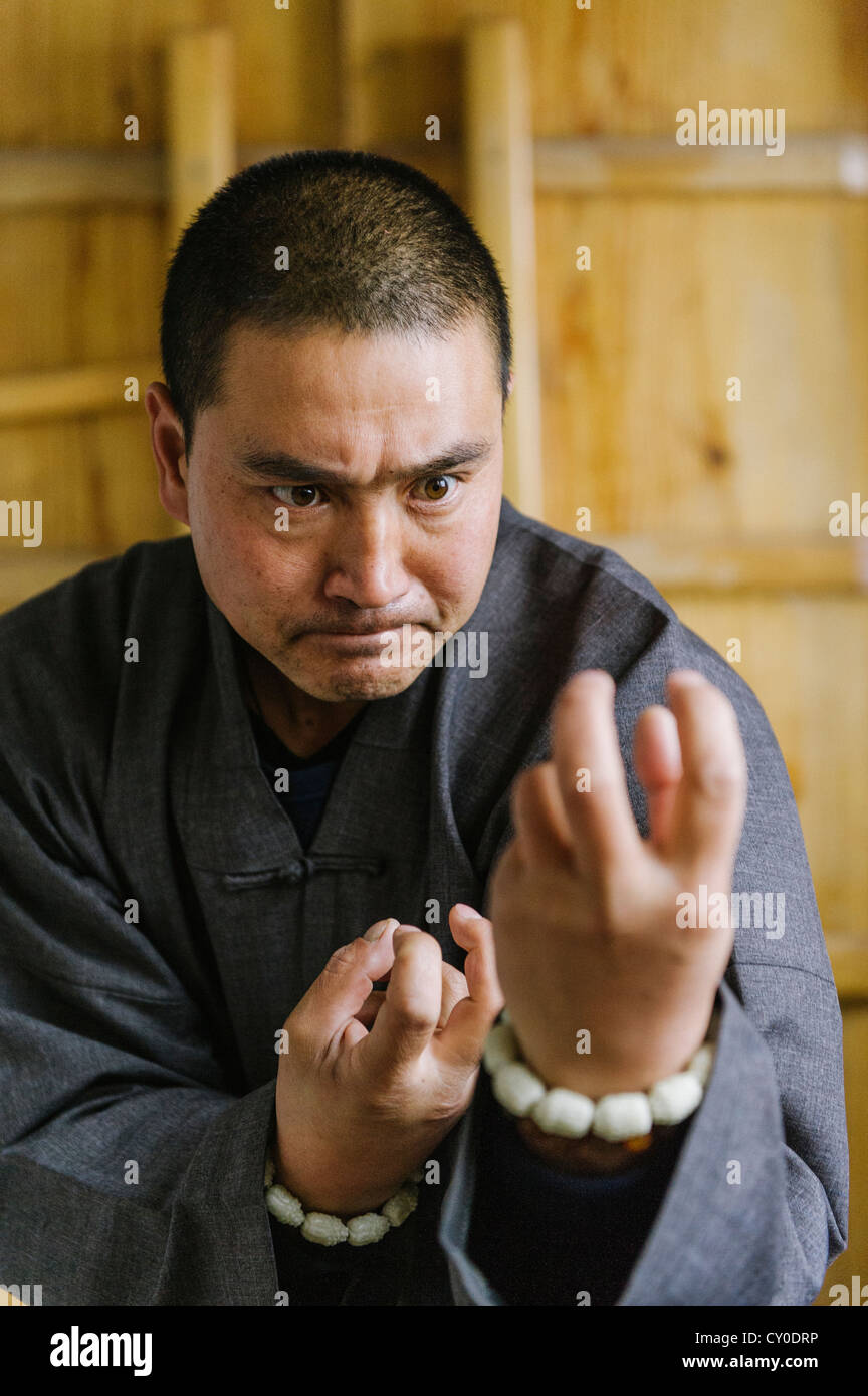 Shaolin Monk Shi De Jian demonstates traditional martial arts at the