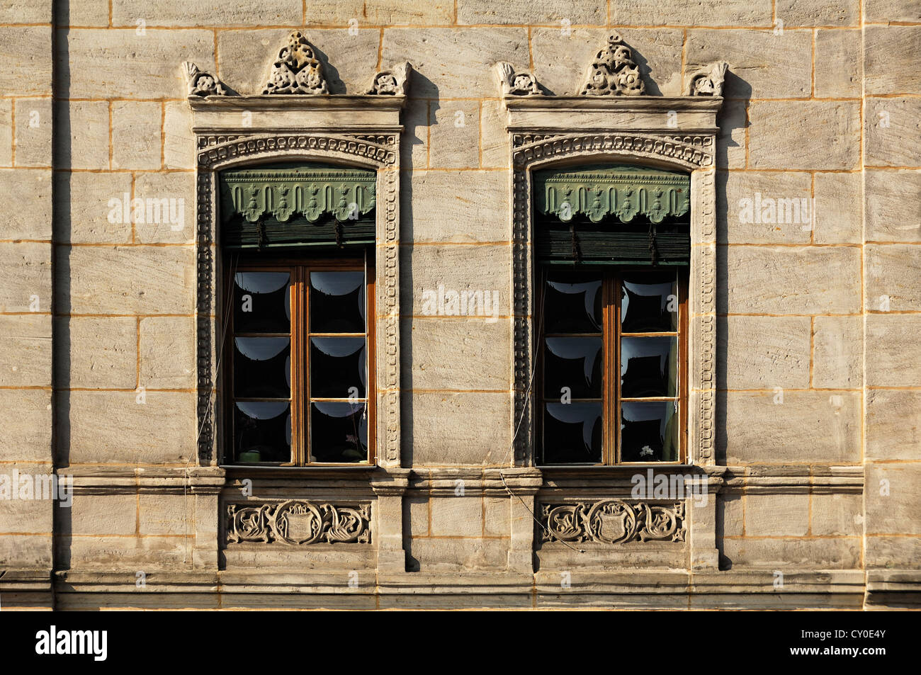 Two windows with ornamental iron shutters from the 19th century, Unterer Markt square 5, Altdorf, Middle Franconia, Bavaria Stock Photo