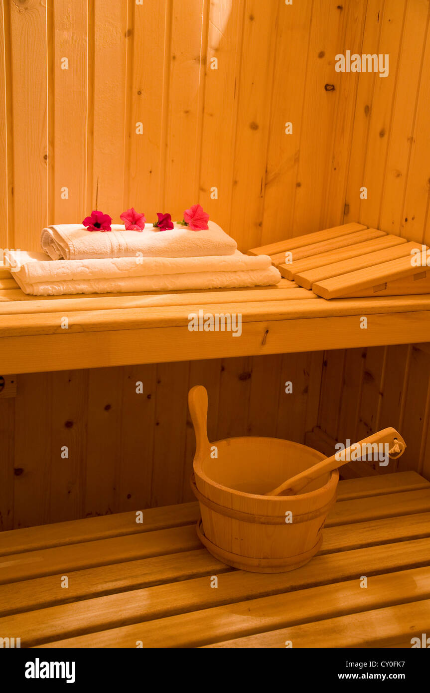 Wooden sauna with all equipment. Interior of a sauna. Advantage for