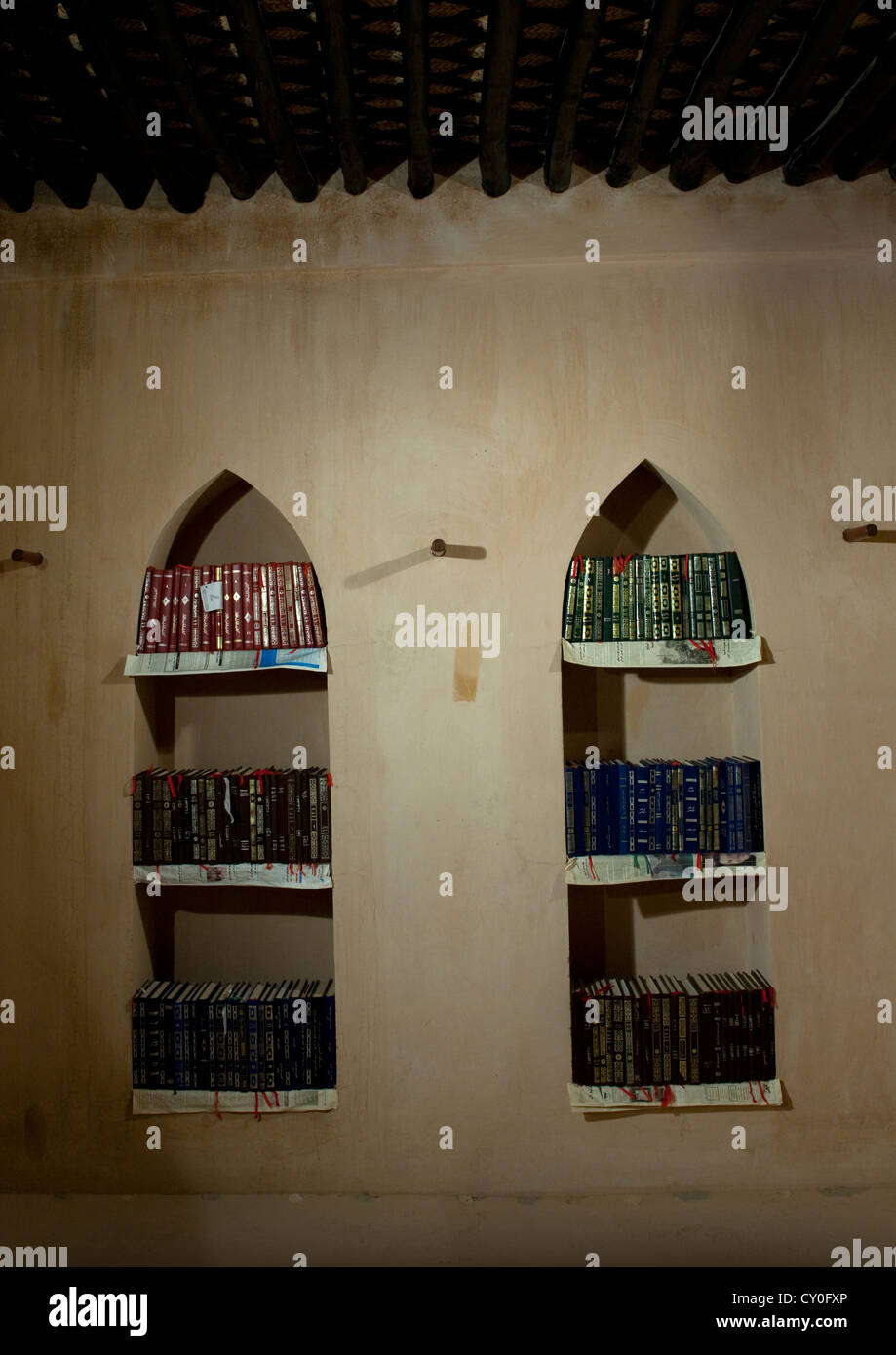 Arabic Book Shelf Full Of Books On The Wall In Sineslah Fort, Sur, Oman