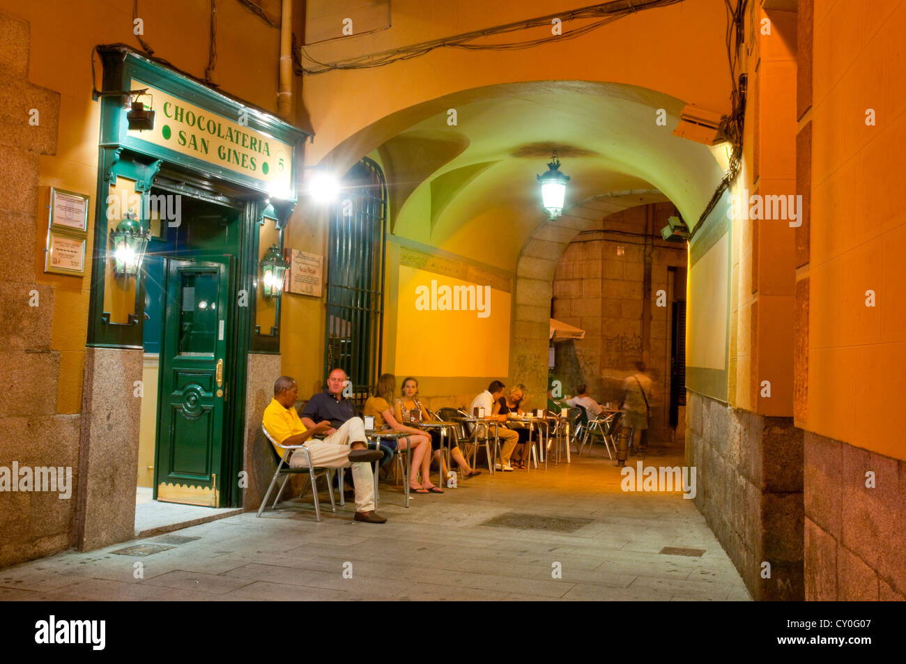 People sitting on terrace at evening. San Gines passage, Madrid, Spain. Stock Photo