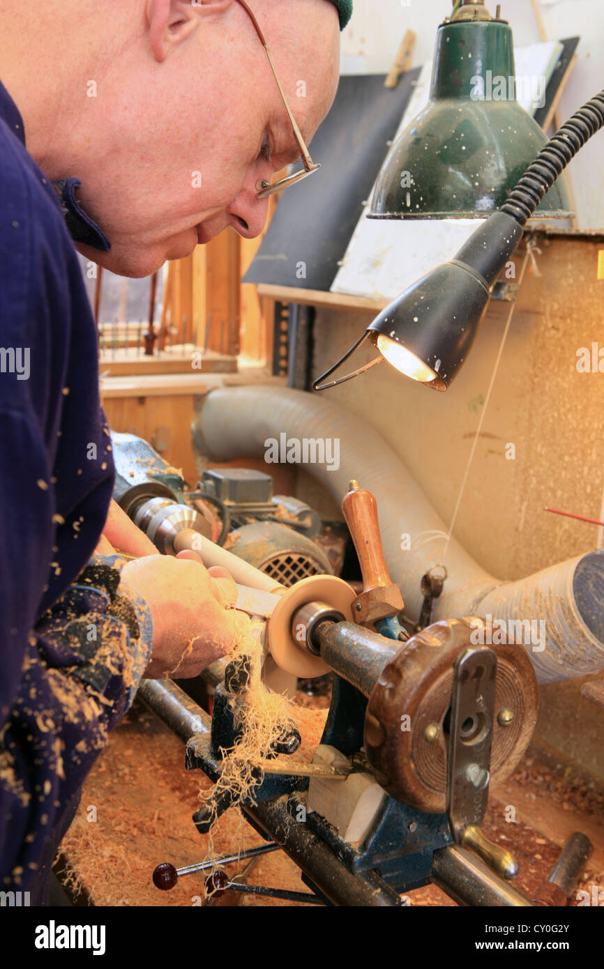 Julian Goodacre Bagpipe maker in Peeples Scotland, using a chisel on