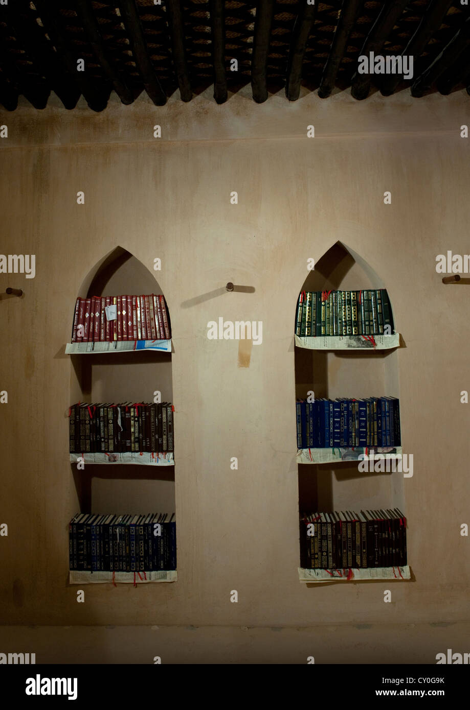 Arabic Book Shelf Full Of Books On The Wall In Sineslah Fort, Sur, Oman