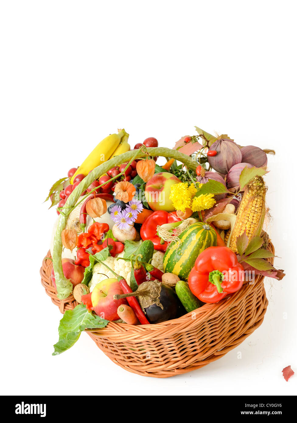 Variety of raw vegetables in wicker basket isolated on white background Stock Photo