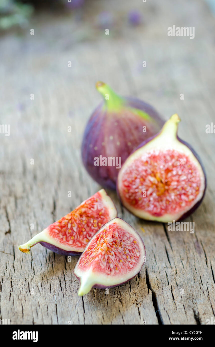 Ripe figs on wooden background Stock Photo