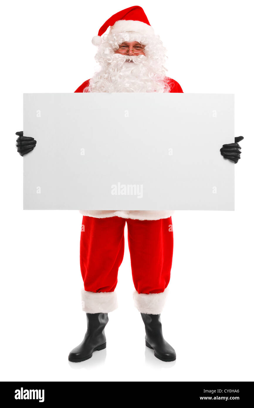 Photo of Santa Claus holding a blank sign, isolated on a white background with copy space to add your own message. Stock Photo