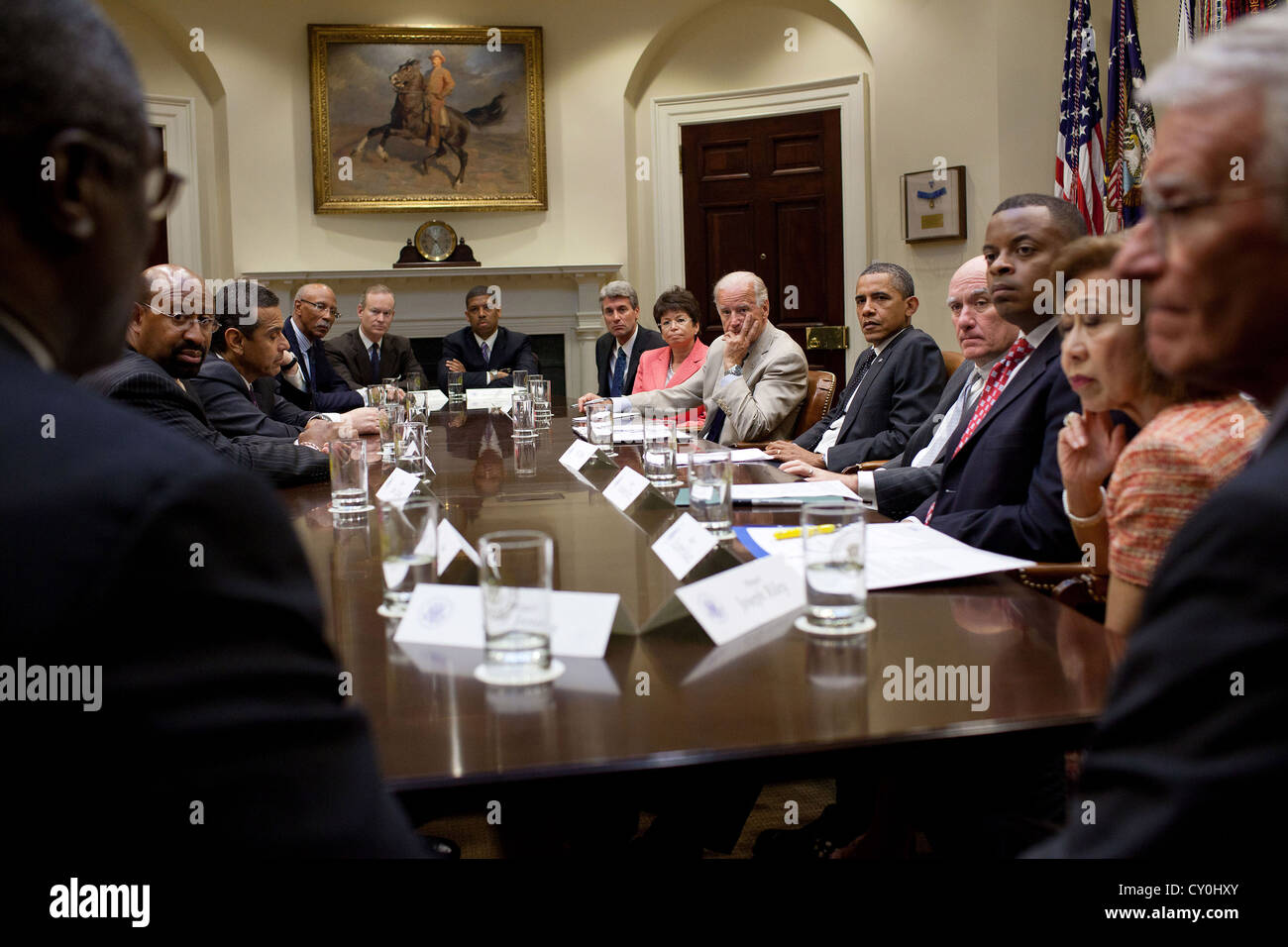 US President Barack Obama and Vice President Joe Biden meet with a bipartisan group of mayors to discuss the economy and local efforts to create jobs and spur economic growth one 20, 2011 in the Roosevelt Room of the White House. Stock Photo