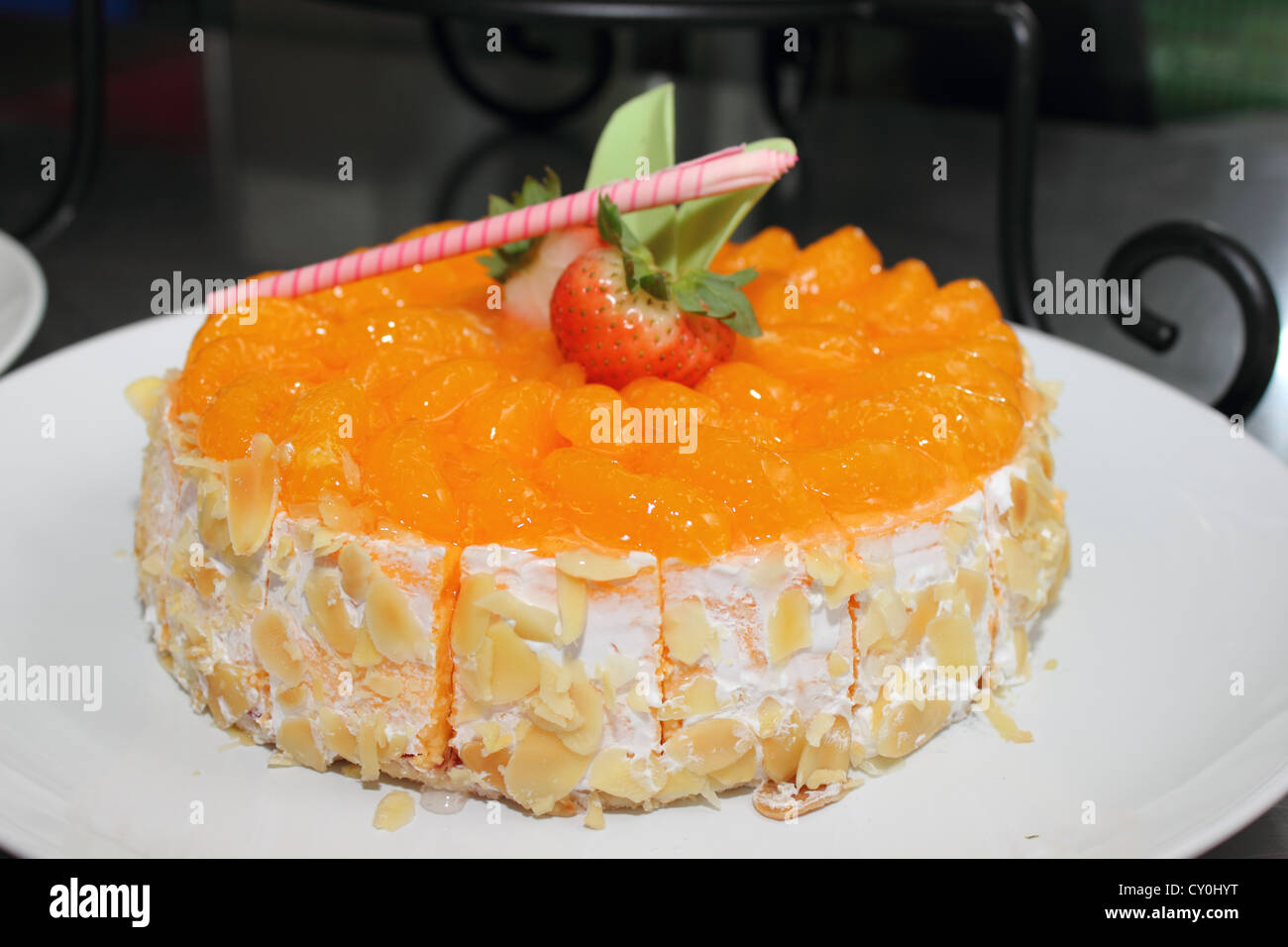 The Orange cake and toping with fruit Stock Photo