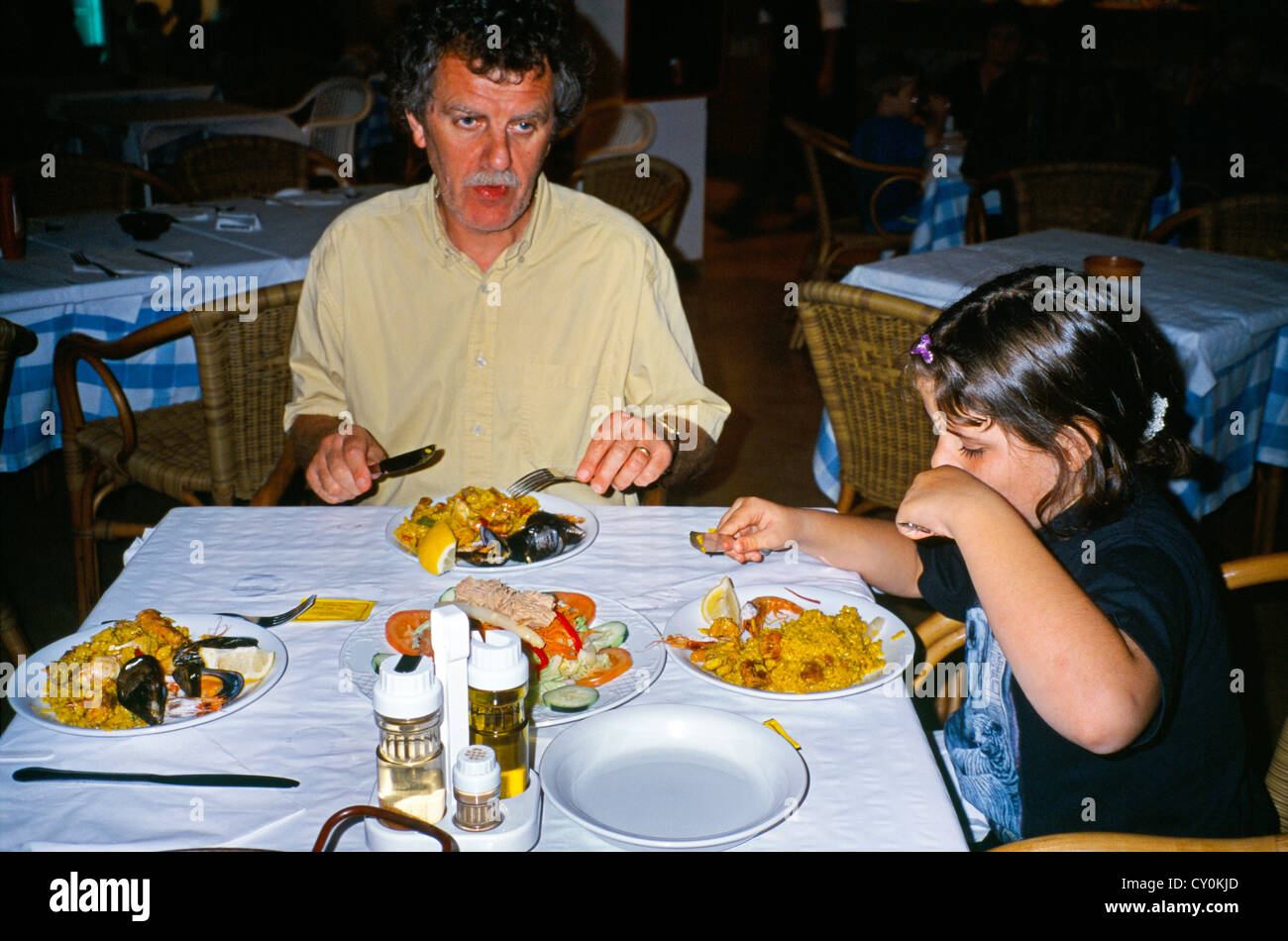 Sant Tomas Menorca (Balearic Islands) Spain Family Eating Paella Stock Photo