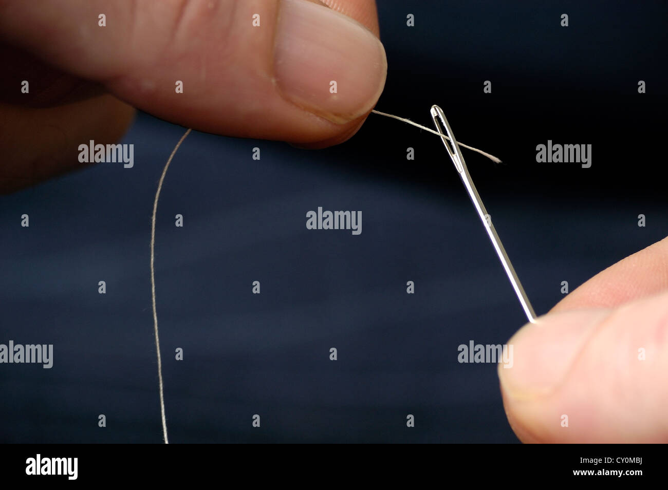 Threading a Needle Stock Photo Alamy