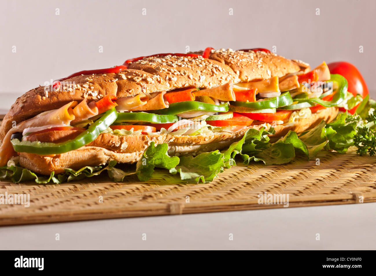 Chicken and Turkey Ham Sandwich with vegetables, brown bread with