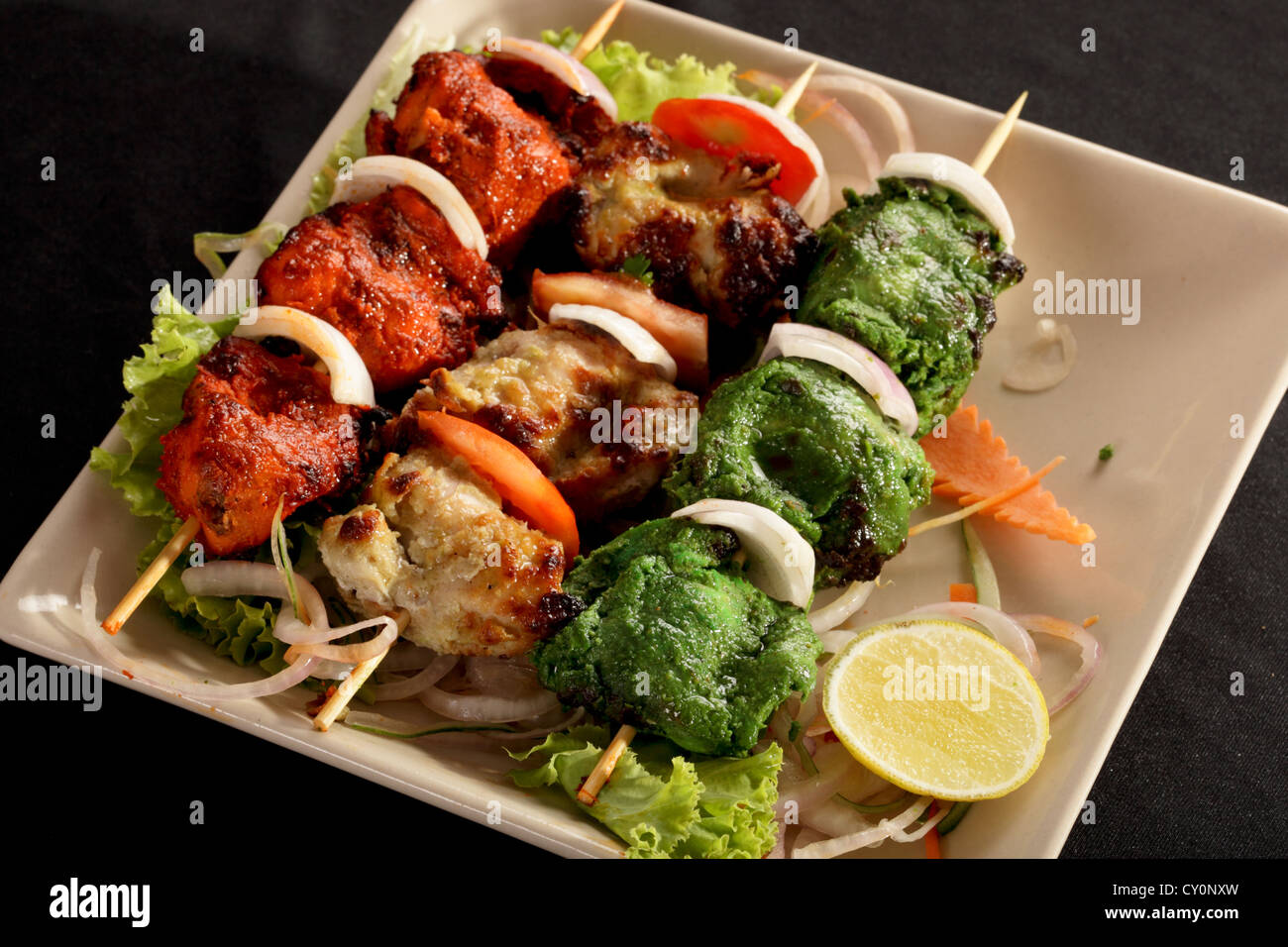 Kebab Platter are small pieces of meat on skewers roasted over charcoal