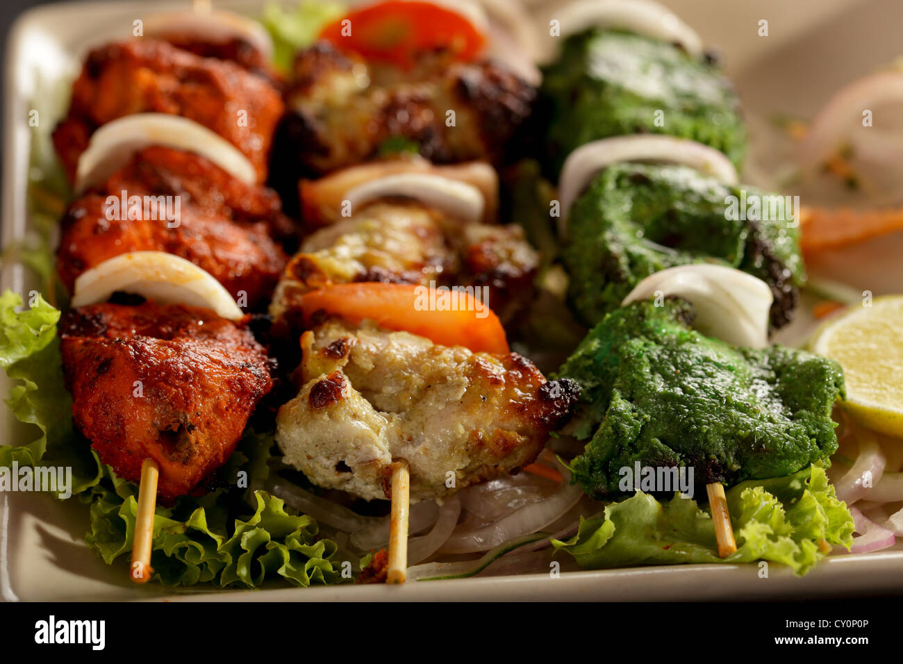 Kebab Platter are small pieces of meat on skewers roasted over charcoal