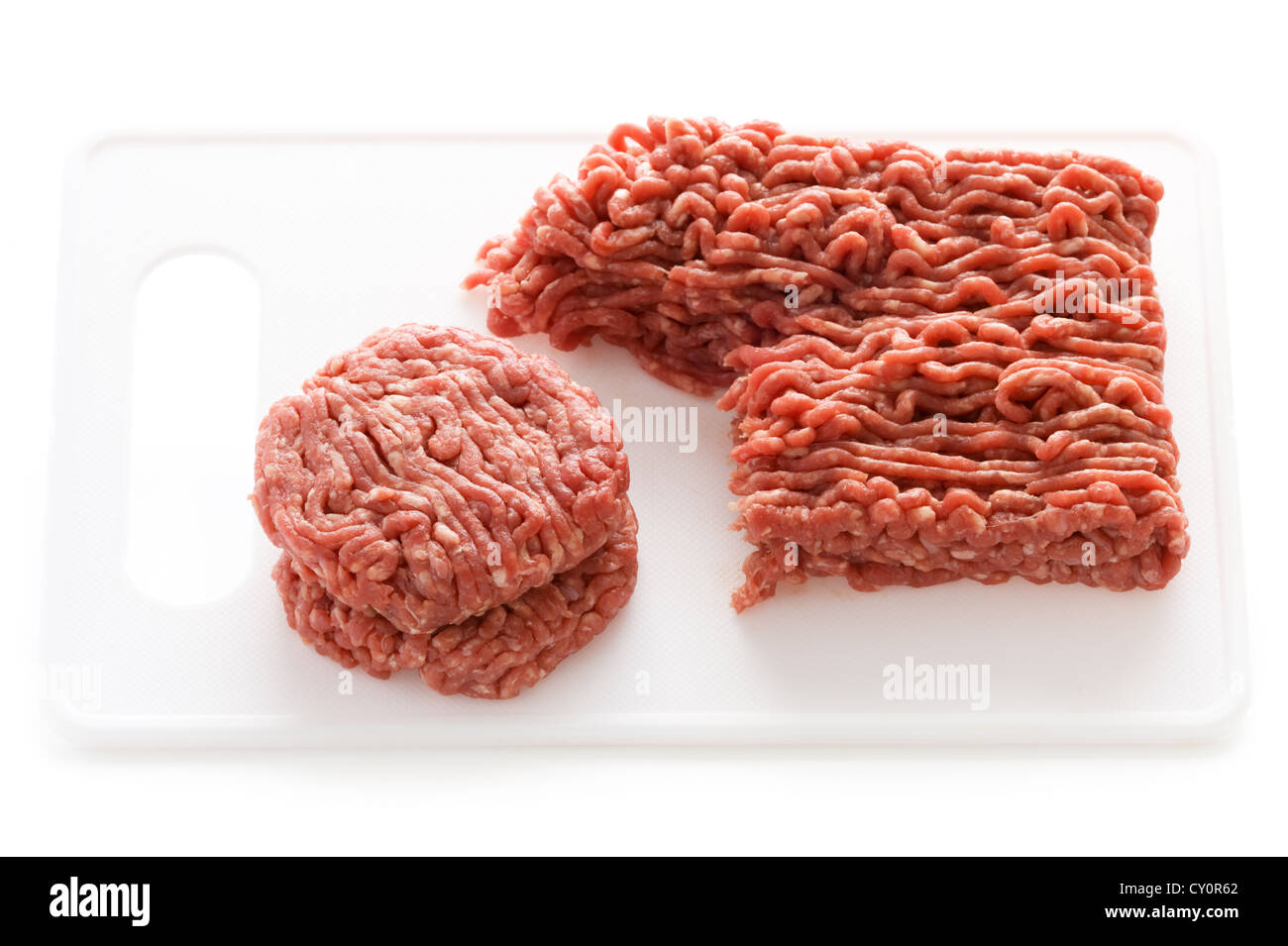 making hamburgers from raw ground beef isolated on a white background Stock Photo