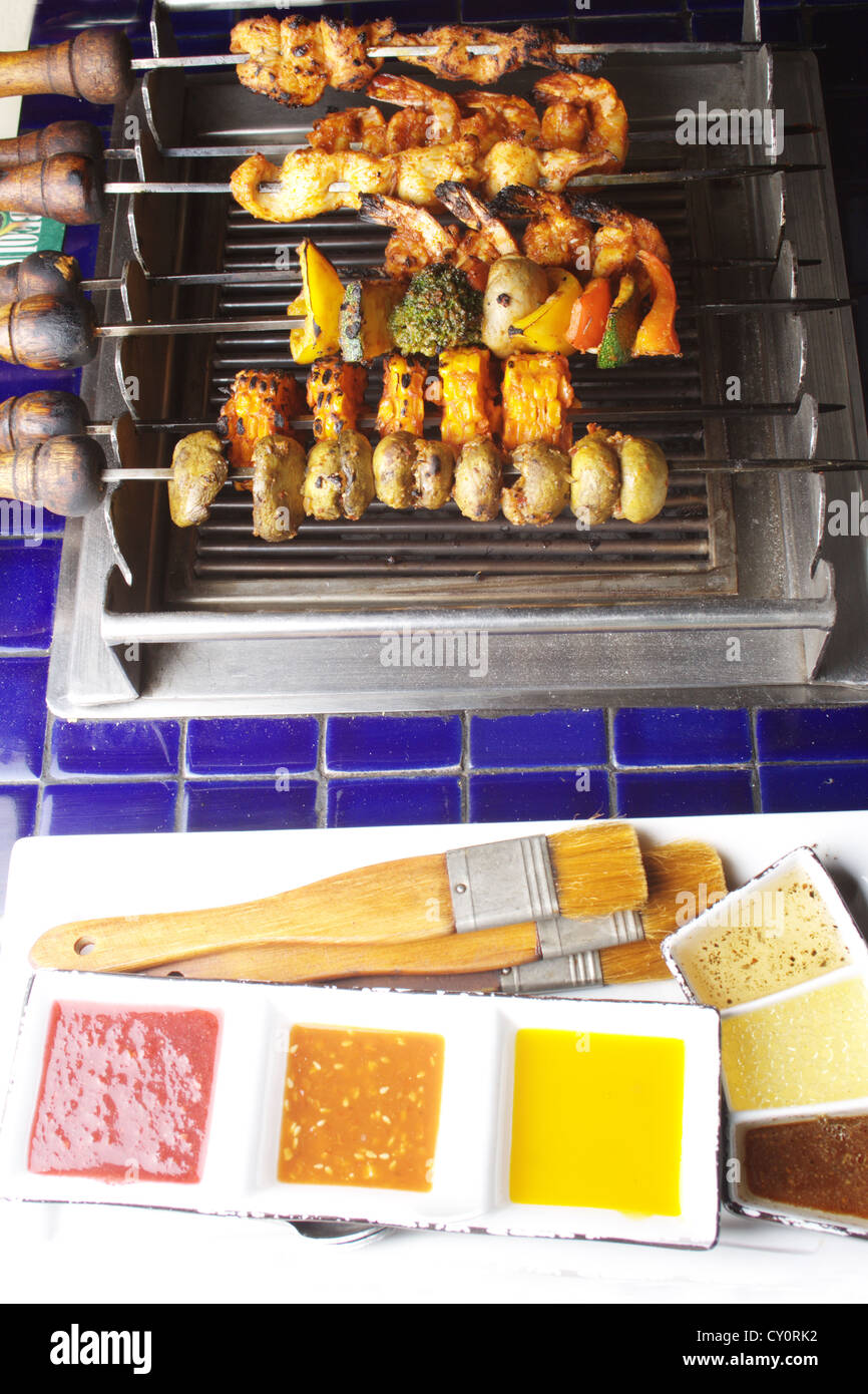 Barbecue Kebab Platter are small pieces of meat on skewers roasted over