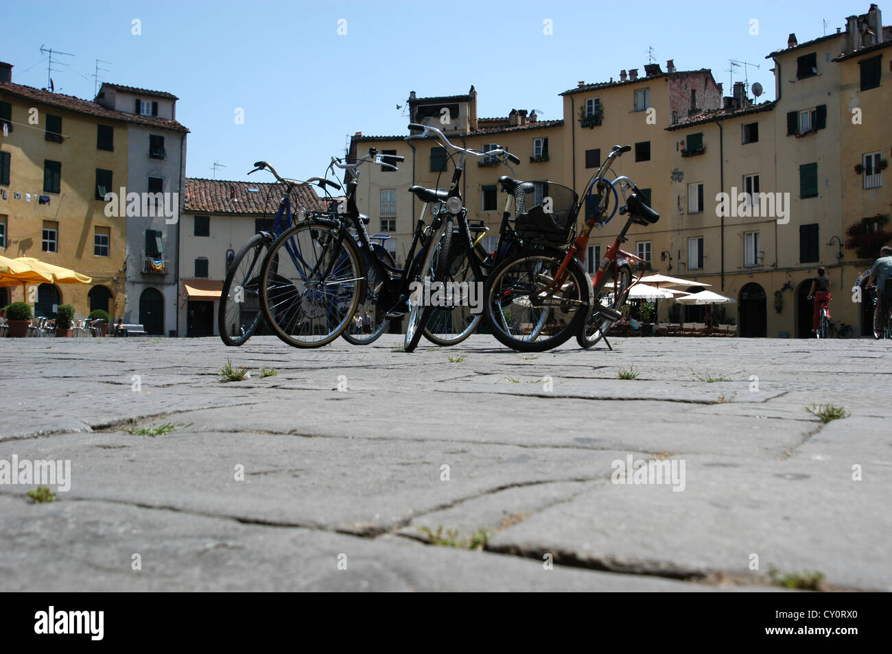 Tourist bicycles for hire in the piazza, in the picturesque village of Lucca, Tuscany, Italy. Stock Photo