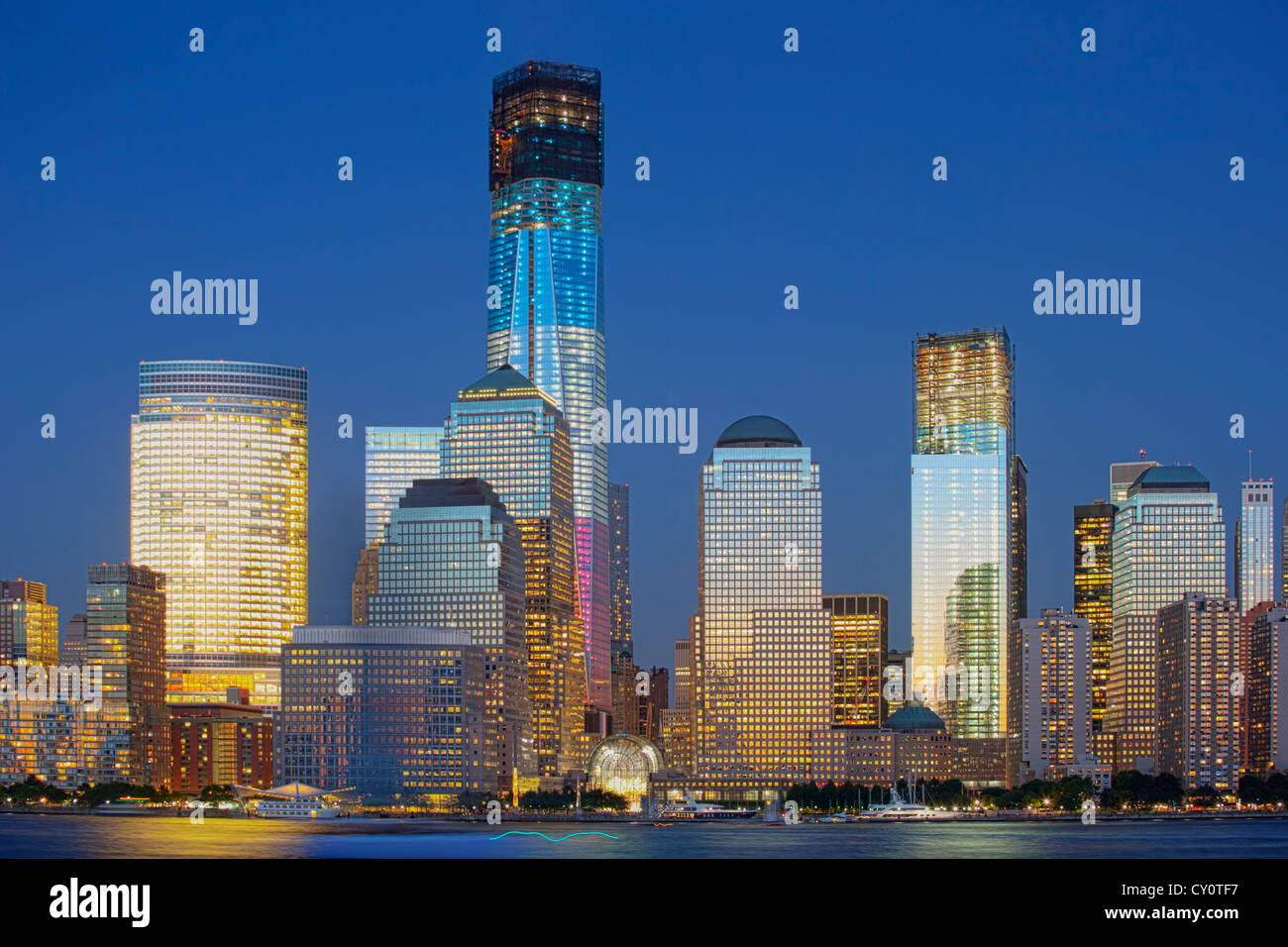 One World Trade Center under construction is illuminated in Red, White and Blue, New York, USA Stock Photo