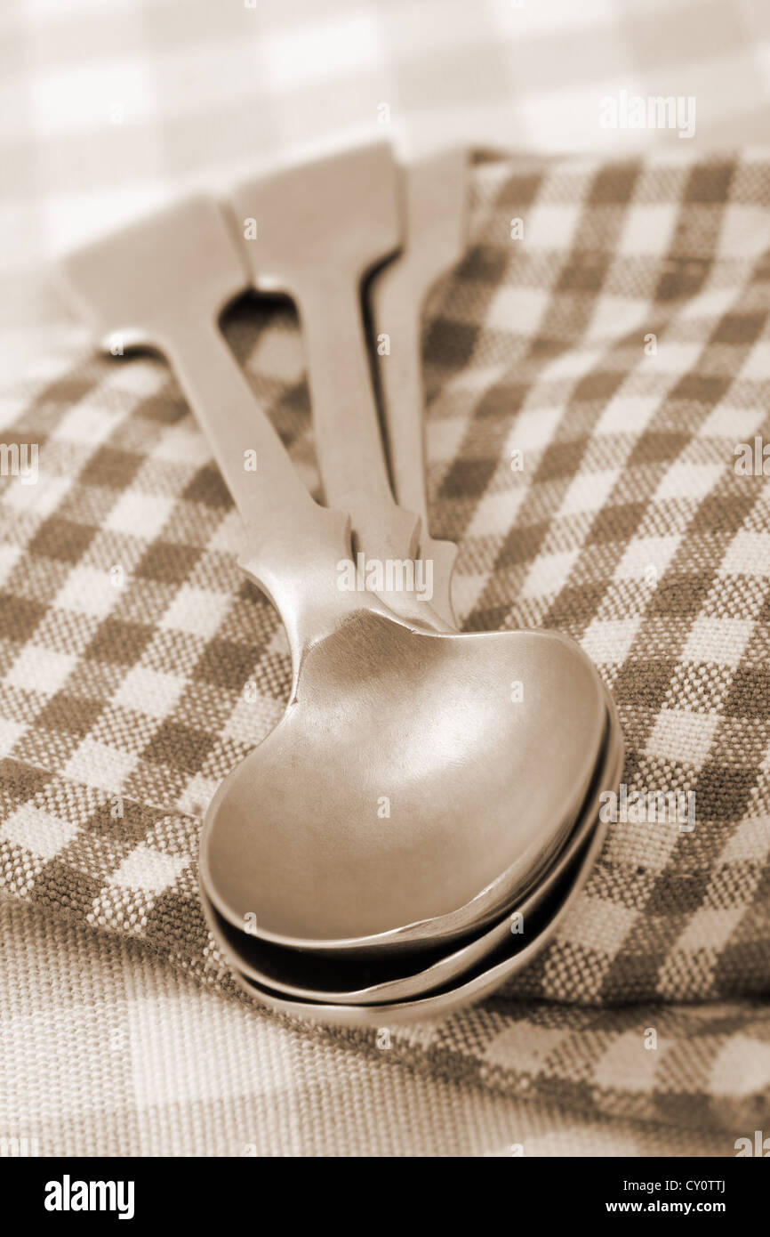old silver spoons, sepia toned Stock Photo