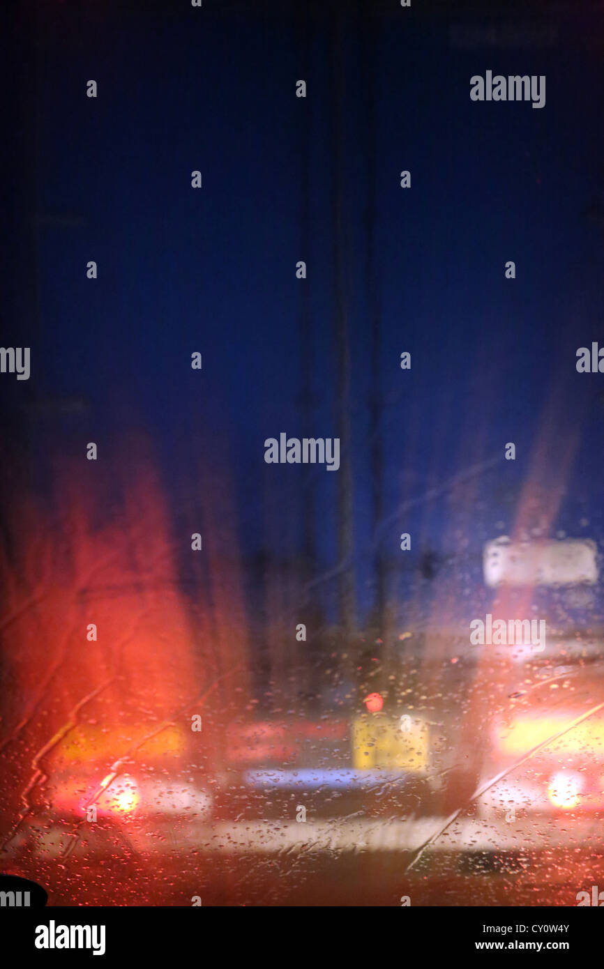 Lorry's Tail Lights At Night Taken Through Car Windscreen In The Rain