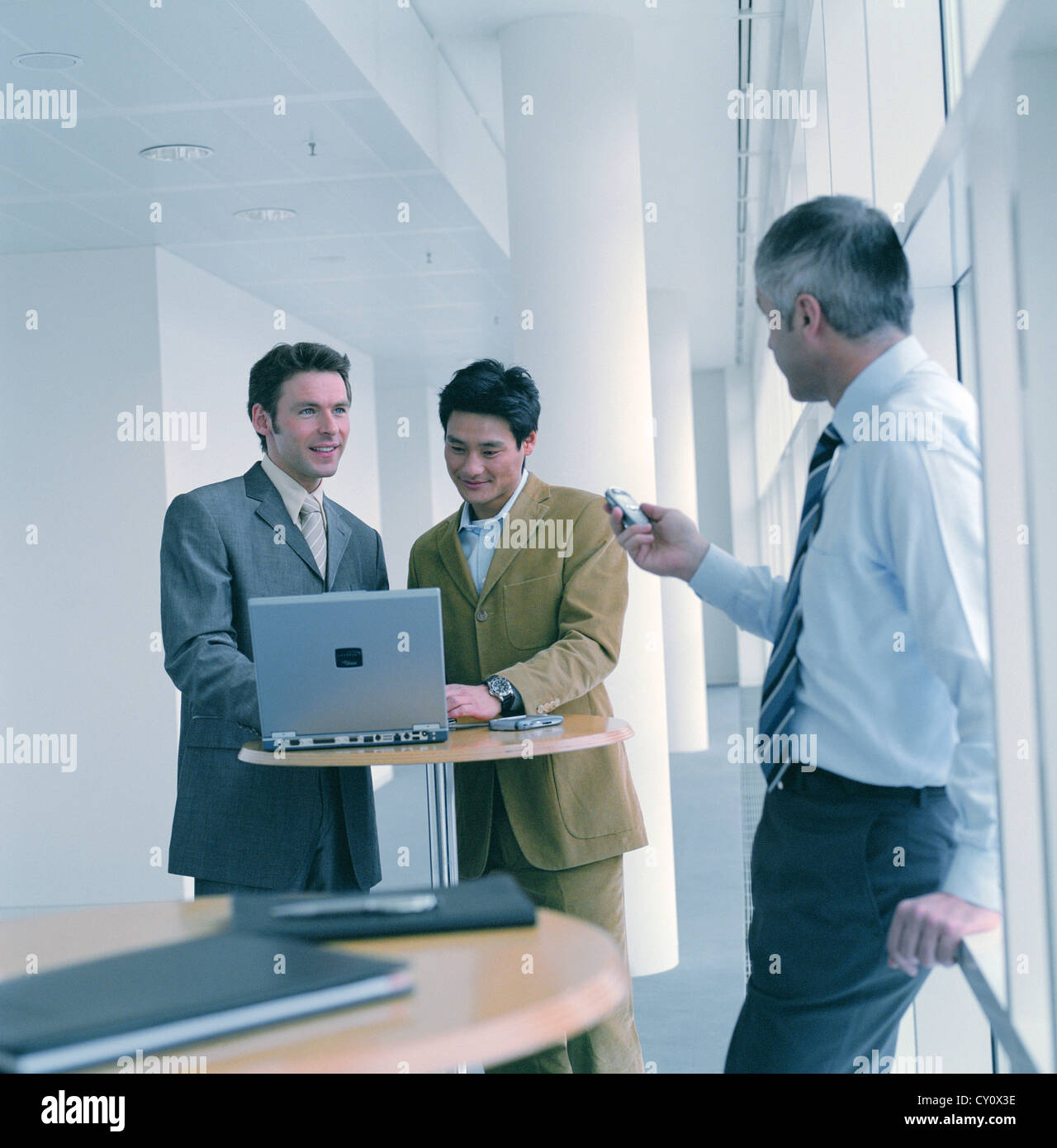 business people man confidence cooperation laptop notebook License free except ads and outdoor billboards Stock Photo