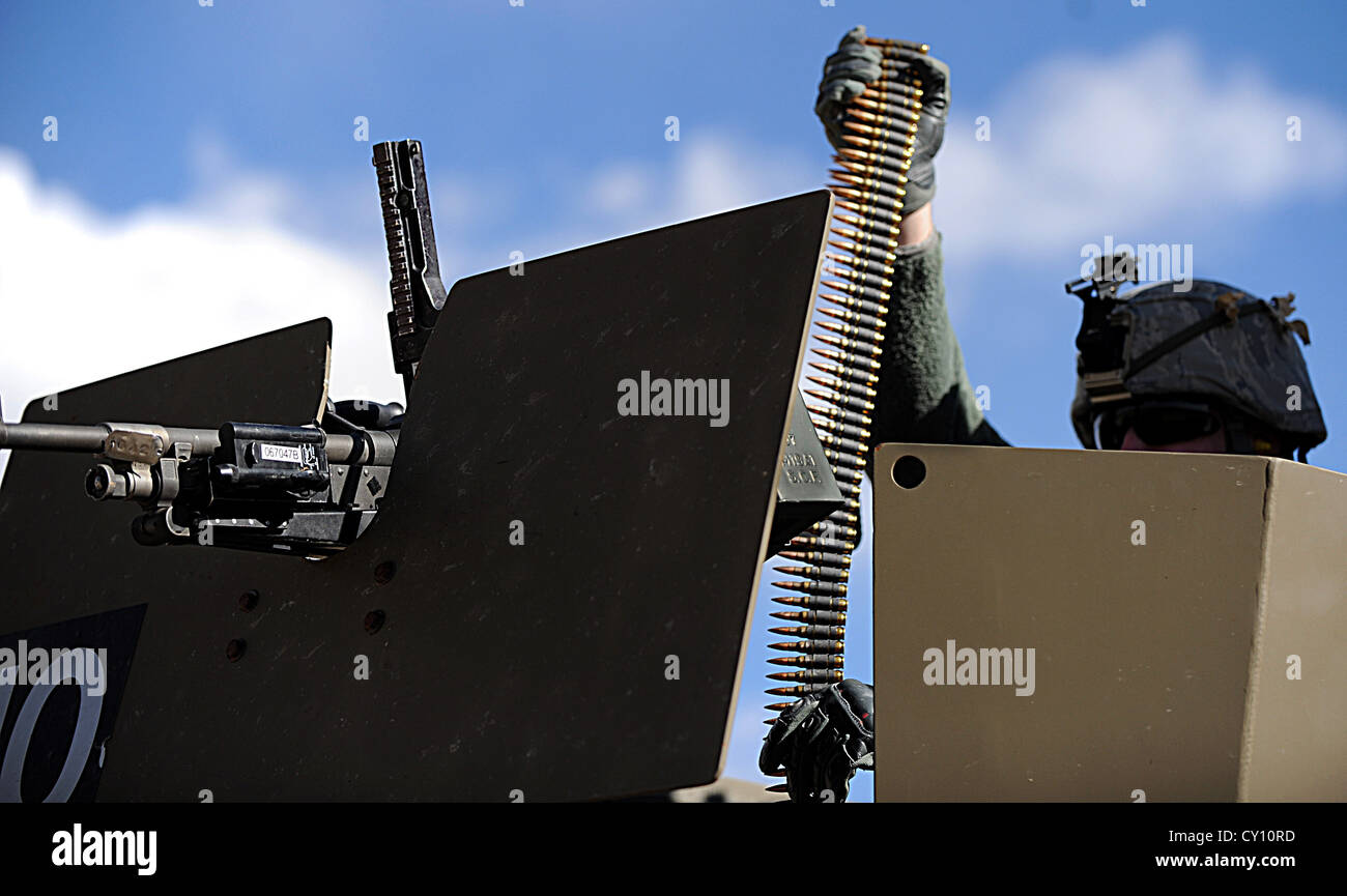 An Airman from F.E. Warren Air Force Base, Wyo. loads rounds into a