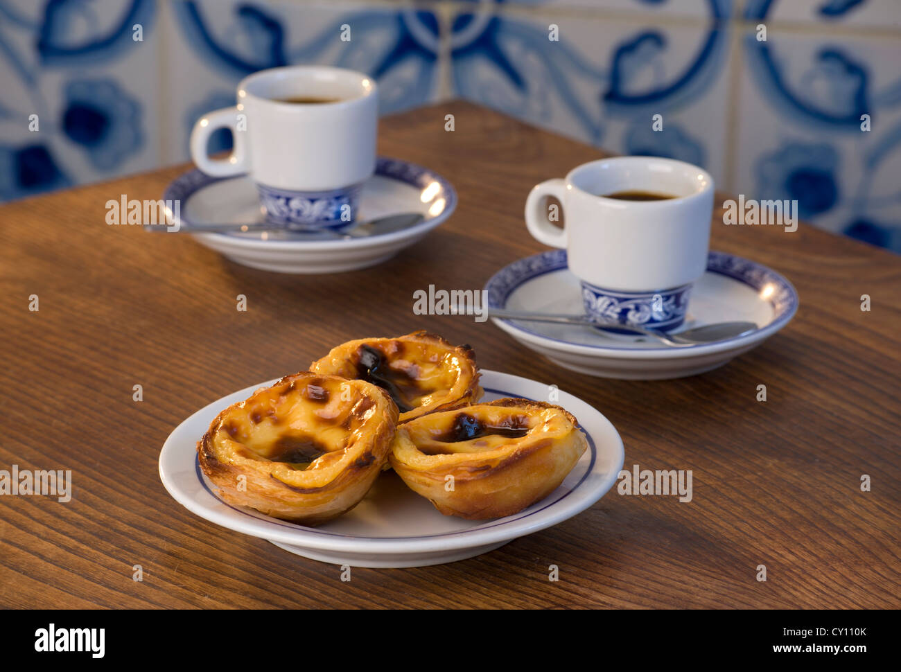 Pasteis de Nata or Pasteis de Belem; custard tarts, on a café table