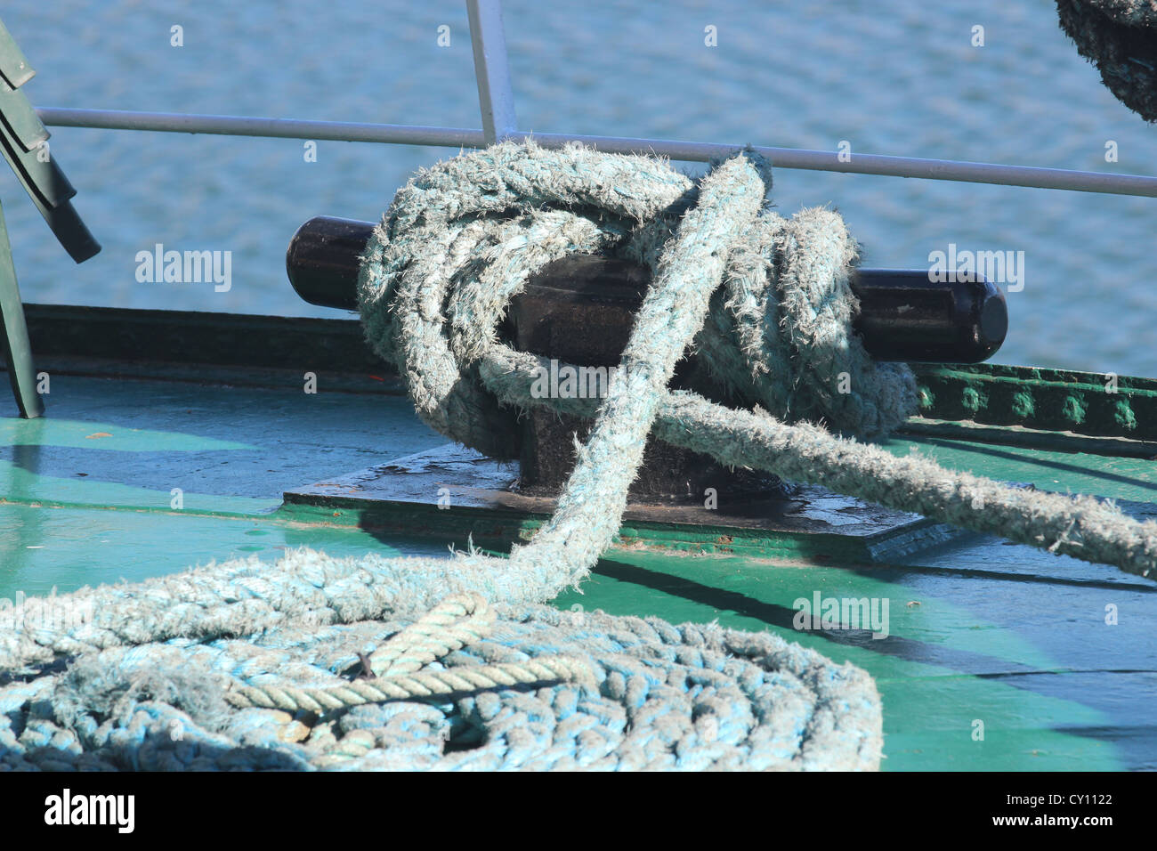 Round coiled light blue rope on boat deck Stock Photo