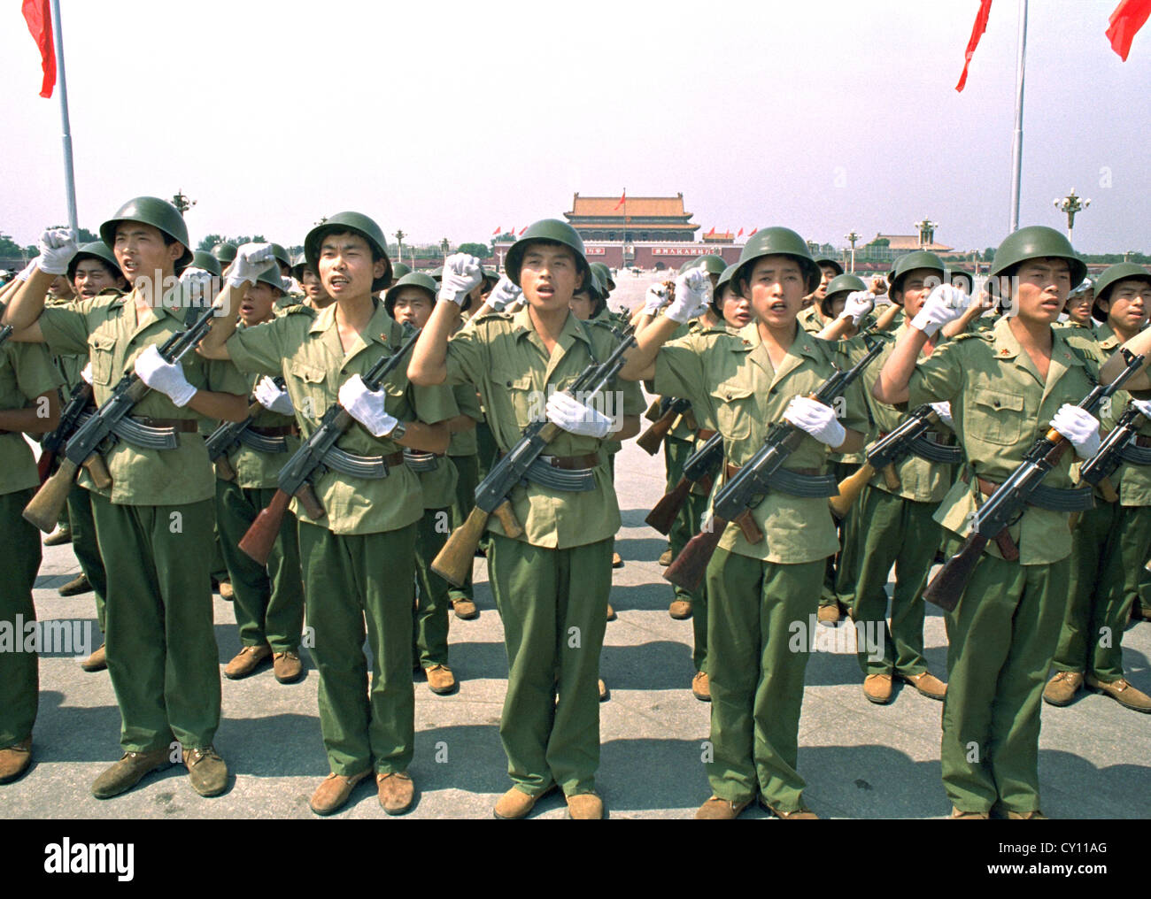People's Liberation Army soldiers take an oath to the communist party in Tiananmen Square July 2, 1989 in Beijing, China. The oath is required by all military following the crackdown on democracy protesters. Stock Photo