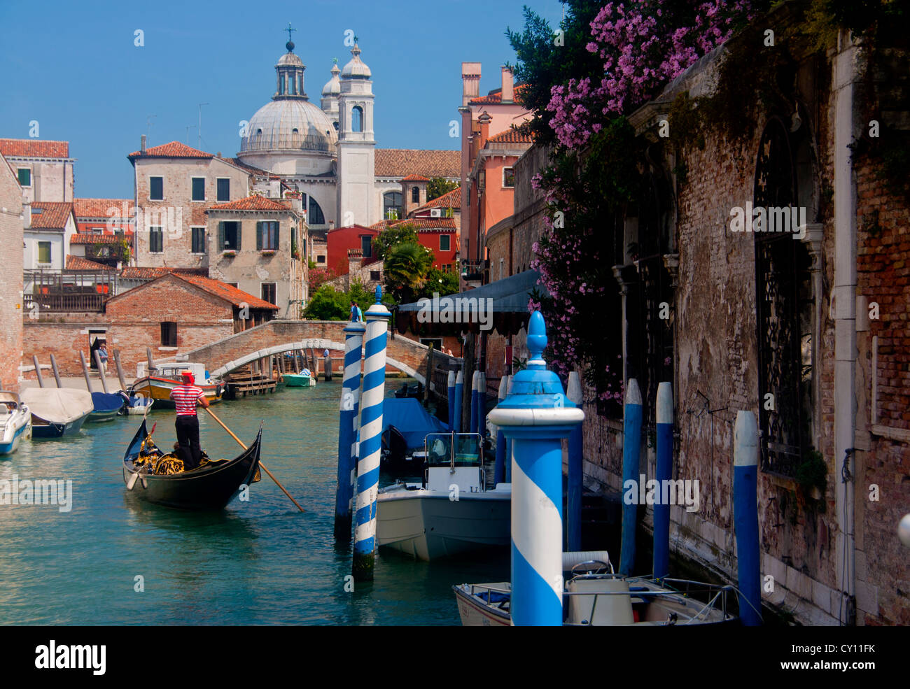Gondola on Rio degli Ognissanti Canal with Gesuiti Church in background Dorsoduro sestier Venice Veneto Italy Stock Photo