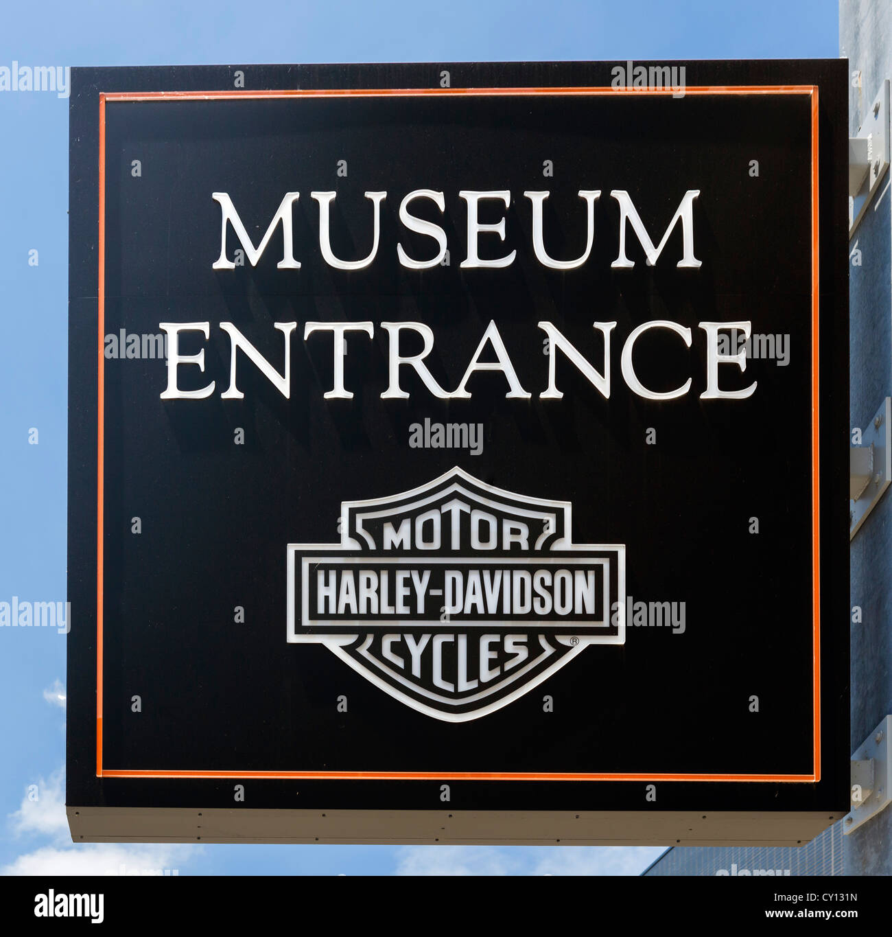 Entrance sign to the Harley Davidson Museum with Harley Davidson motorcycles parked outside, Milwaukee, Wisconsin, USA Stock Photo