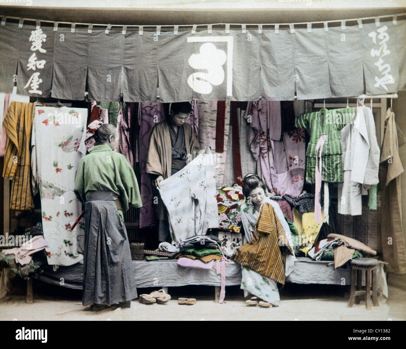 Japanese Street Vendor of Clothing, Hand Colored Albumen Photograph