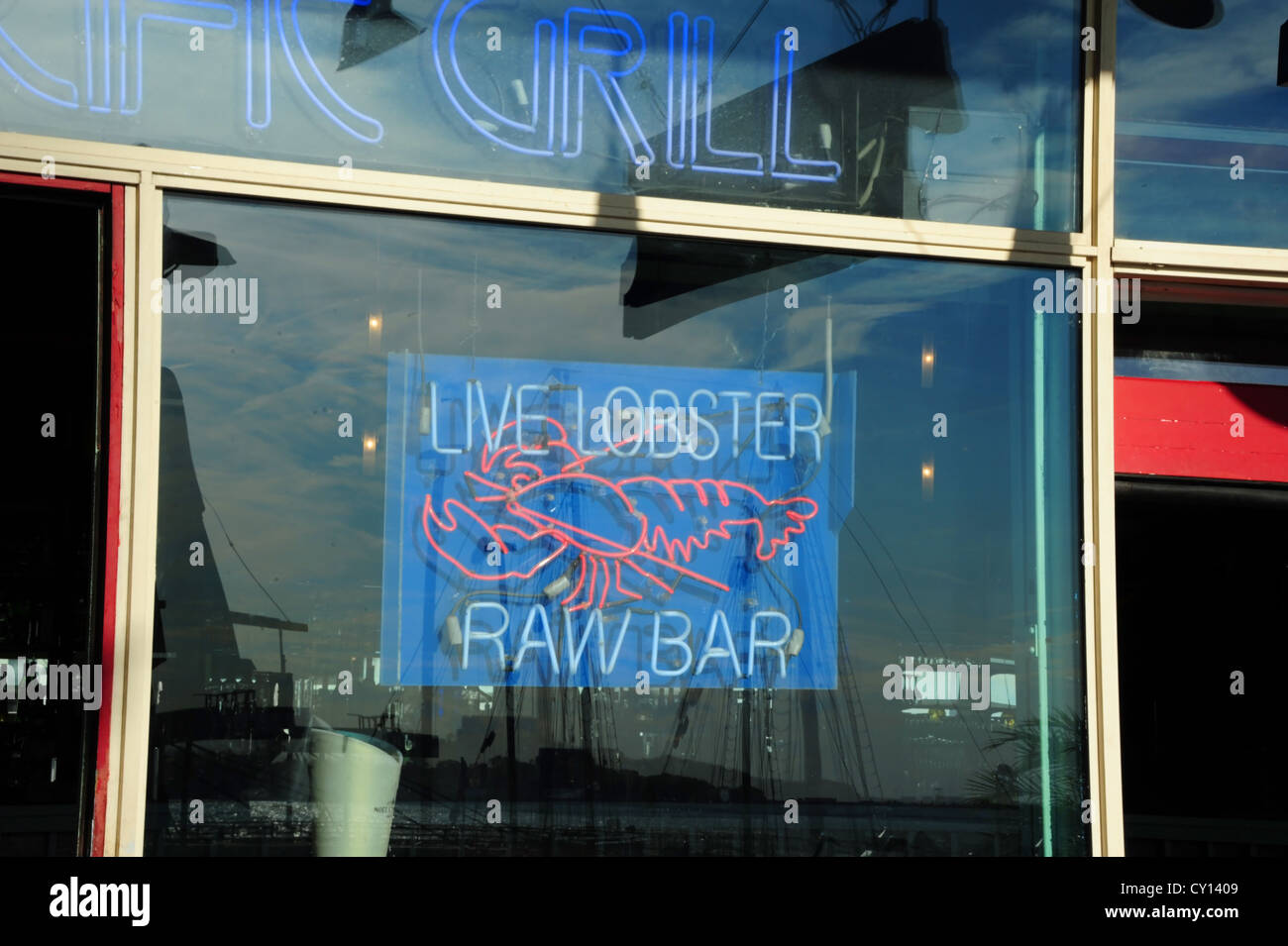 Glass window neon sign advertising 'Live Lobster Raw Bar', Pacific