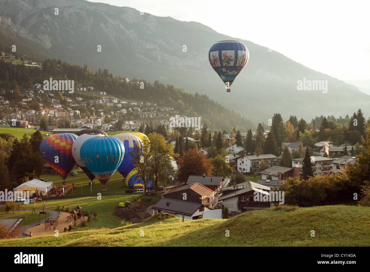 Hot air balloons lift off from the international alpine balloon festival, Flims Switzerland, Europe Stock Photo