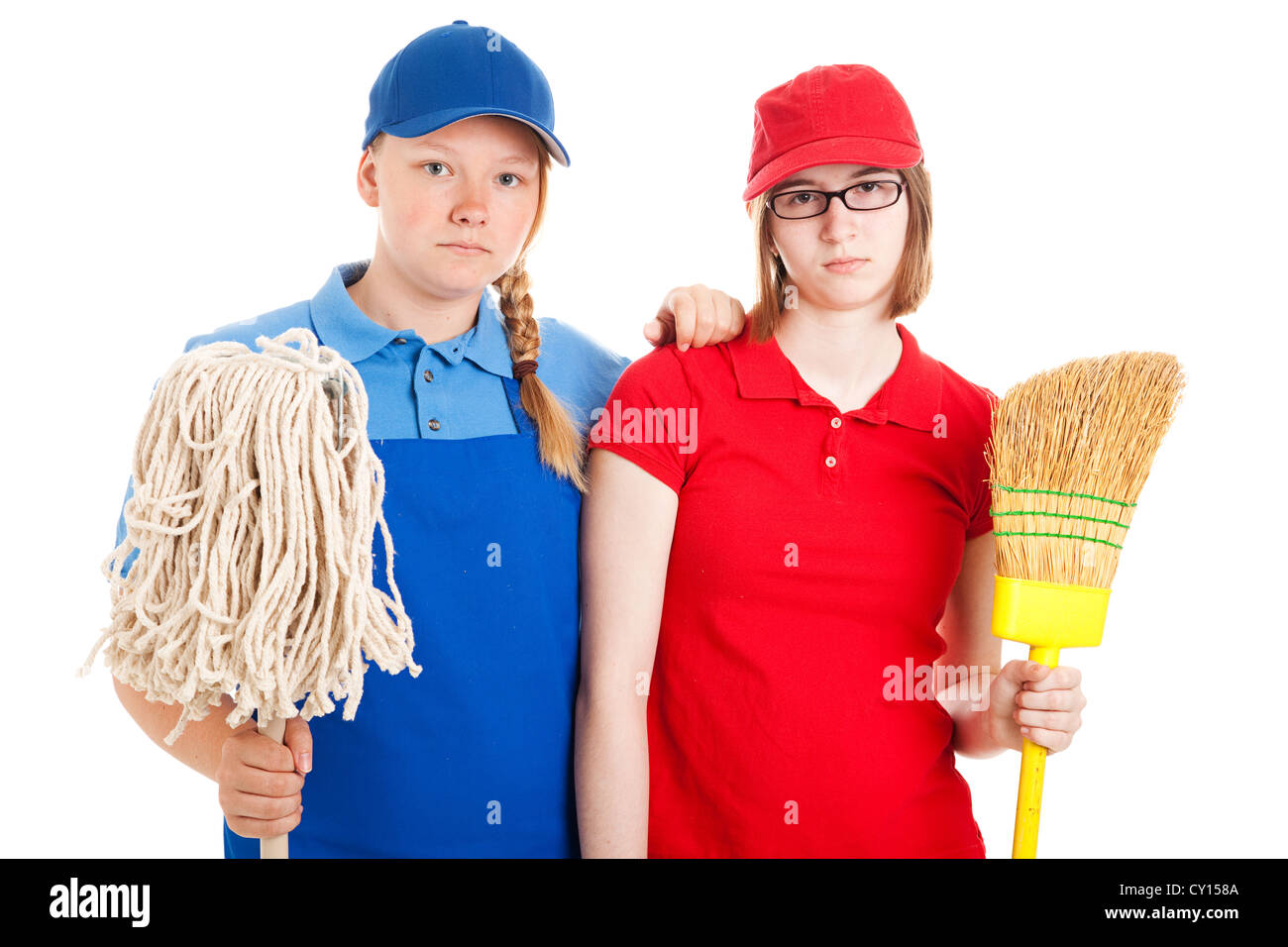 Two serious looking teenage girls, dressed in uniforms for menial jobs